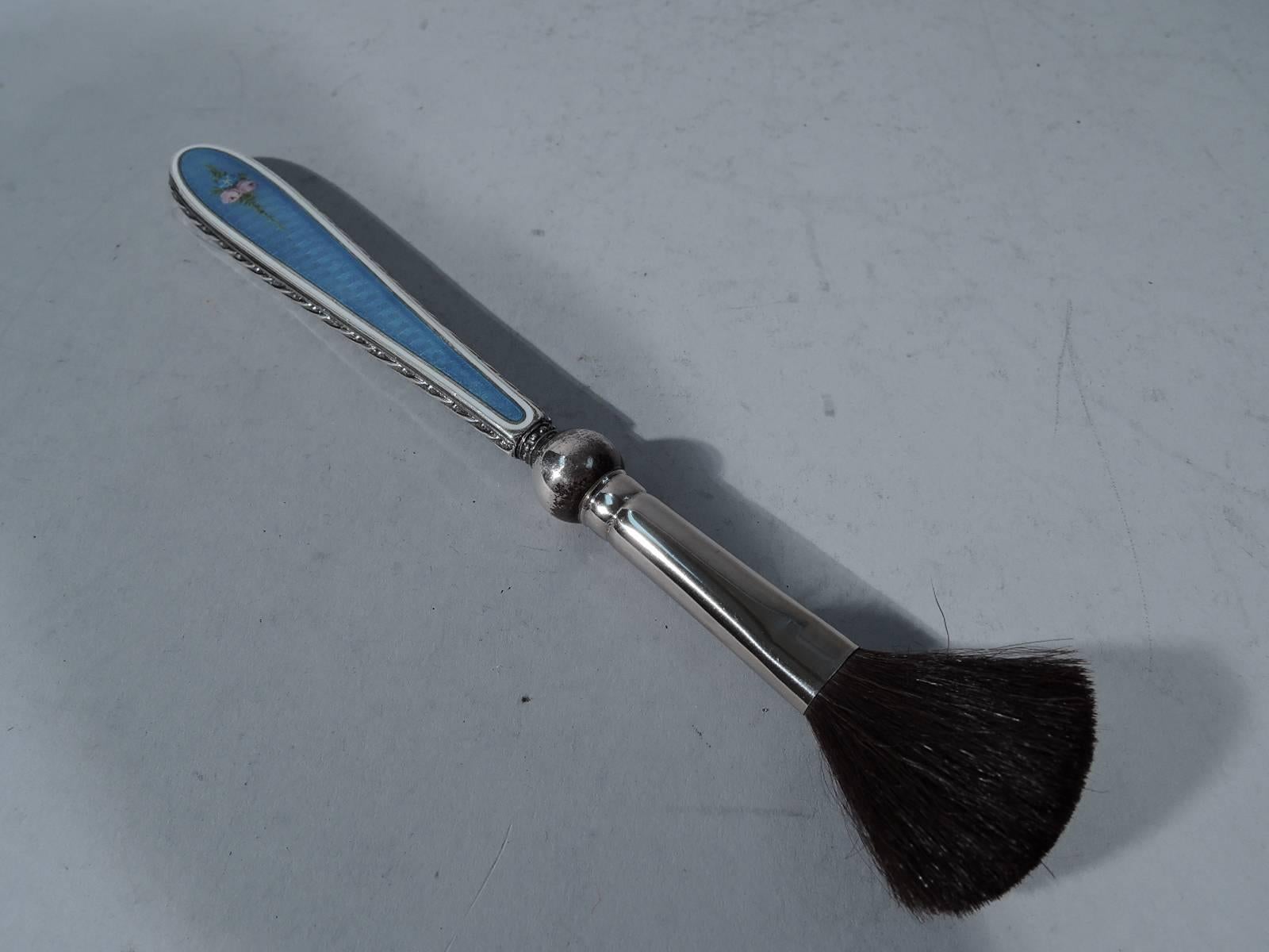 Antique Edwardian sterling silver powder brush. Tapering handle with double-sided enameled flowers on blue ground and silver imbricated leaf ornament. Hallmarked “sterling”. Fine condition with new bristles.

Length: 7 3/4 in. BO390.