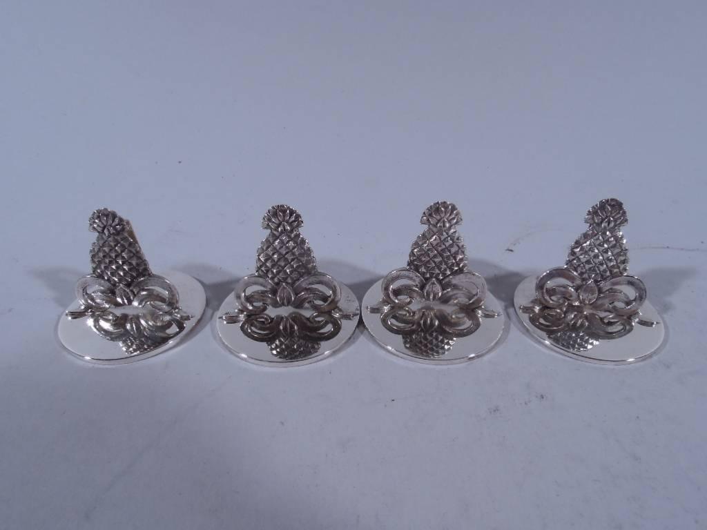 Nice set of 12 sterling silver place cardholders. Made by Thomae in Attleboro for Tiffany & Co. in New York. Fine quality pineapple with hinged clip on bow mounted to circular disk. Maker’s and retailer’s marks. Very good patina and
