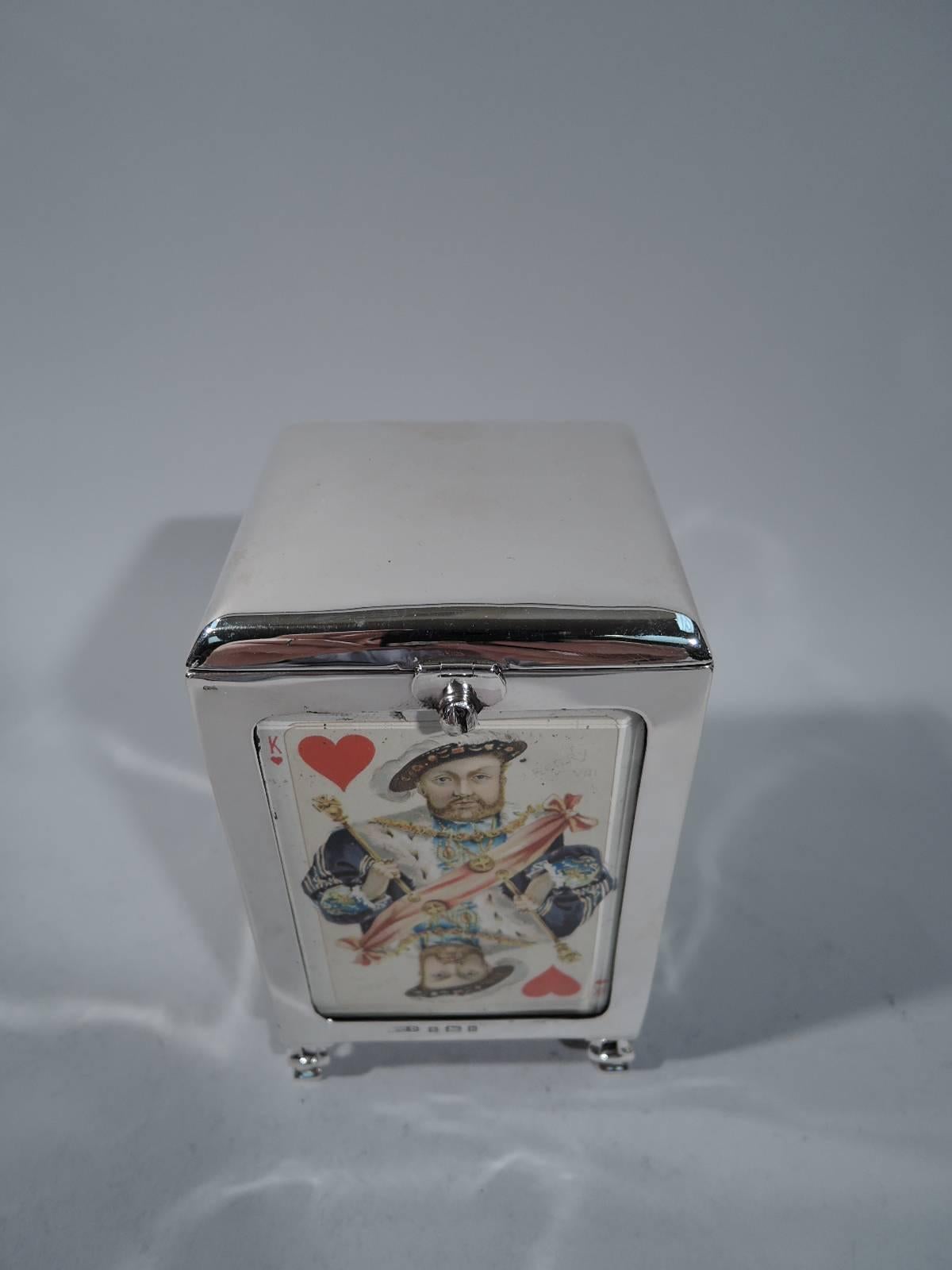 Edwardian sterling silver playing cards box. Made by Henry Clifford Davis in Birmingham in 1901. Rectilinear with hinged cover. Each side glazed and faced with antique card. Box and cover interior lined and partitioned with library-red leather.