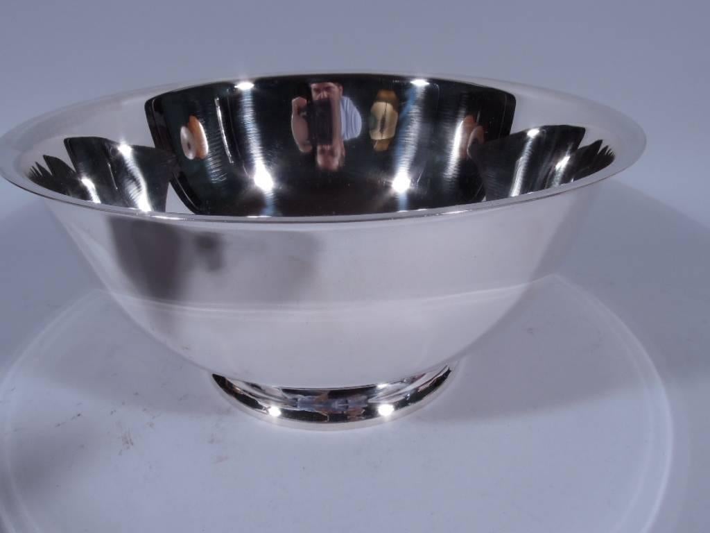 Sterling silver Revere bowl. Made by Tiffany & Co. in New York. Traditional revere form with curved sides, flared rim, and spread foot. Hallmark includes postwar pattern no. 23619. Very good condition. Large dimensions: H 5 x D 10 1/2 in. Heavy