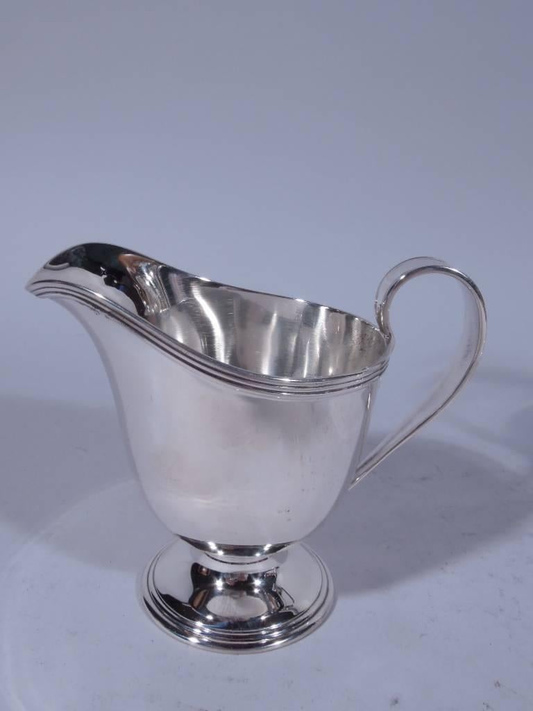 antique silver creamer and sugar