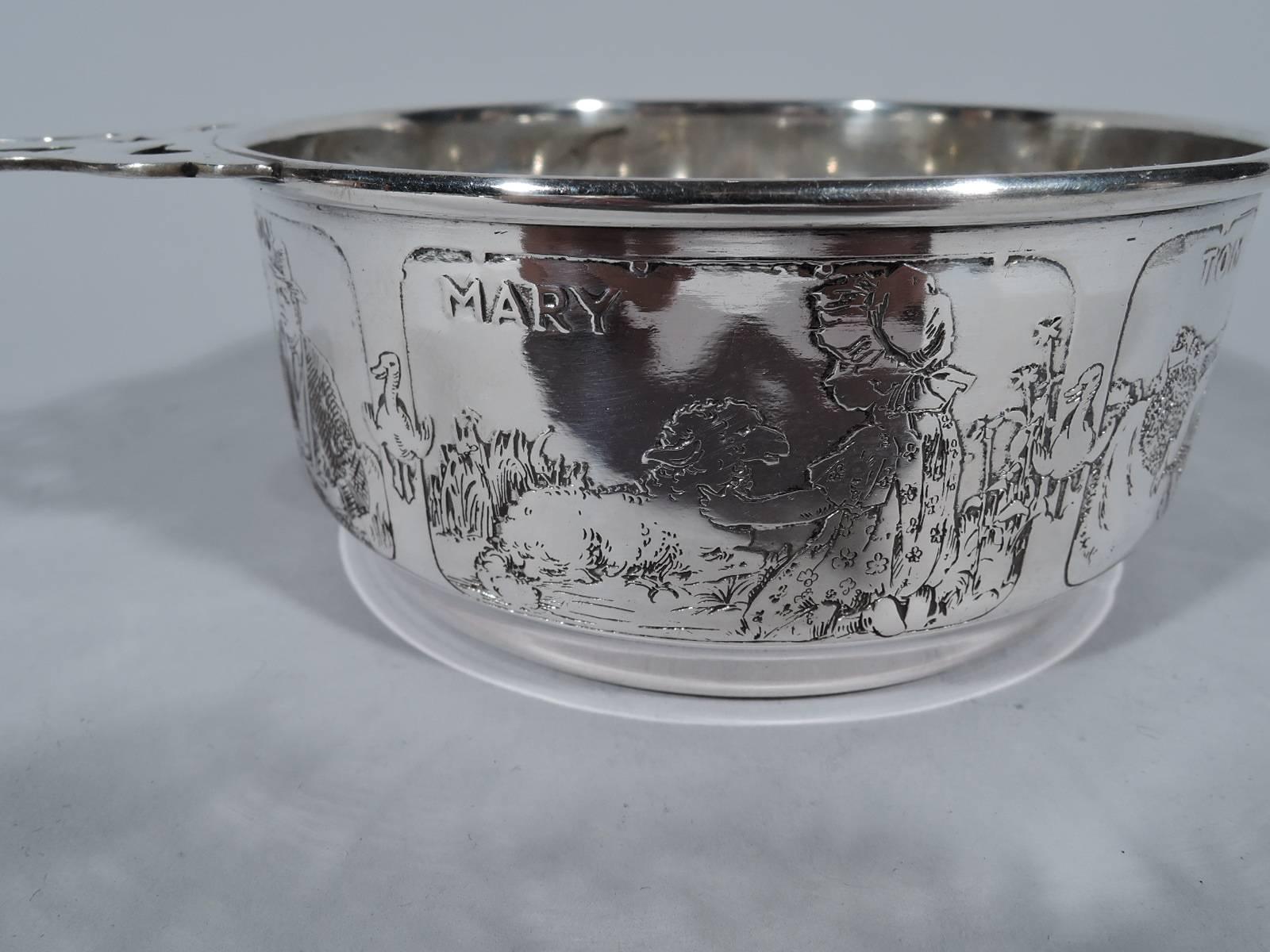 Sterling silver porringer. Made by Kerr in Newark, circa 1910. Straight sides acid-etched with famous nursery rhyme characters. The frames depict jack sprat and his non-lean eating wife, little Jack Horner with pulled-out plum, simple Simon, tom the