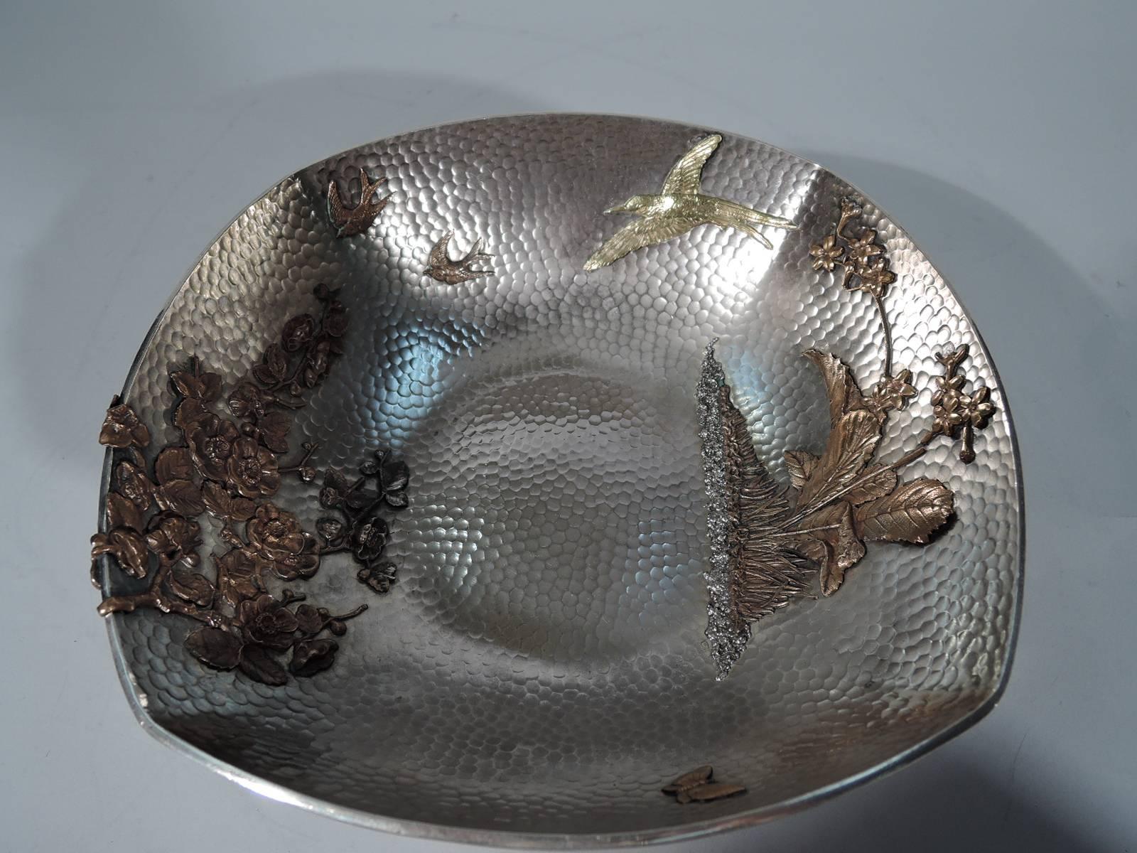 Rare and beautiful hand-hammered sterling silver bowl with mixed metal. Made by Gorham in Providence in 1880. Four curved sides with honeycomb hand hammering. Interior has applied mixed metal ornament: butterfly, birds, flower planted in granulated