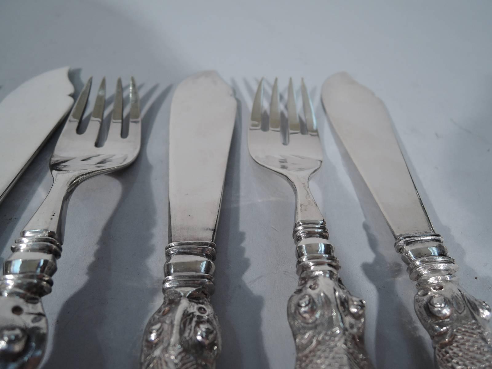 Chinese export silver fish set, circa 1900. This set comprises six forks and six knives. Each handle is a fish (carp) with scales, pierced tail, fins, and exophthalmic eyes. A practical adaptation of a popular Asian motif. Forks have curved shank