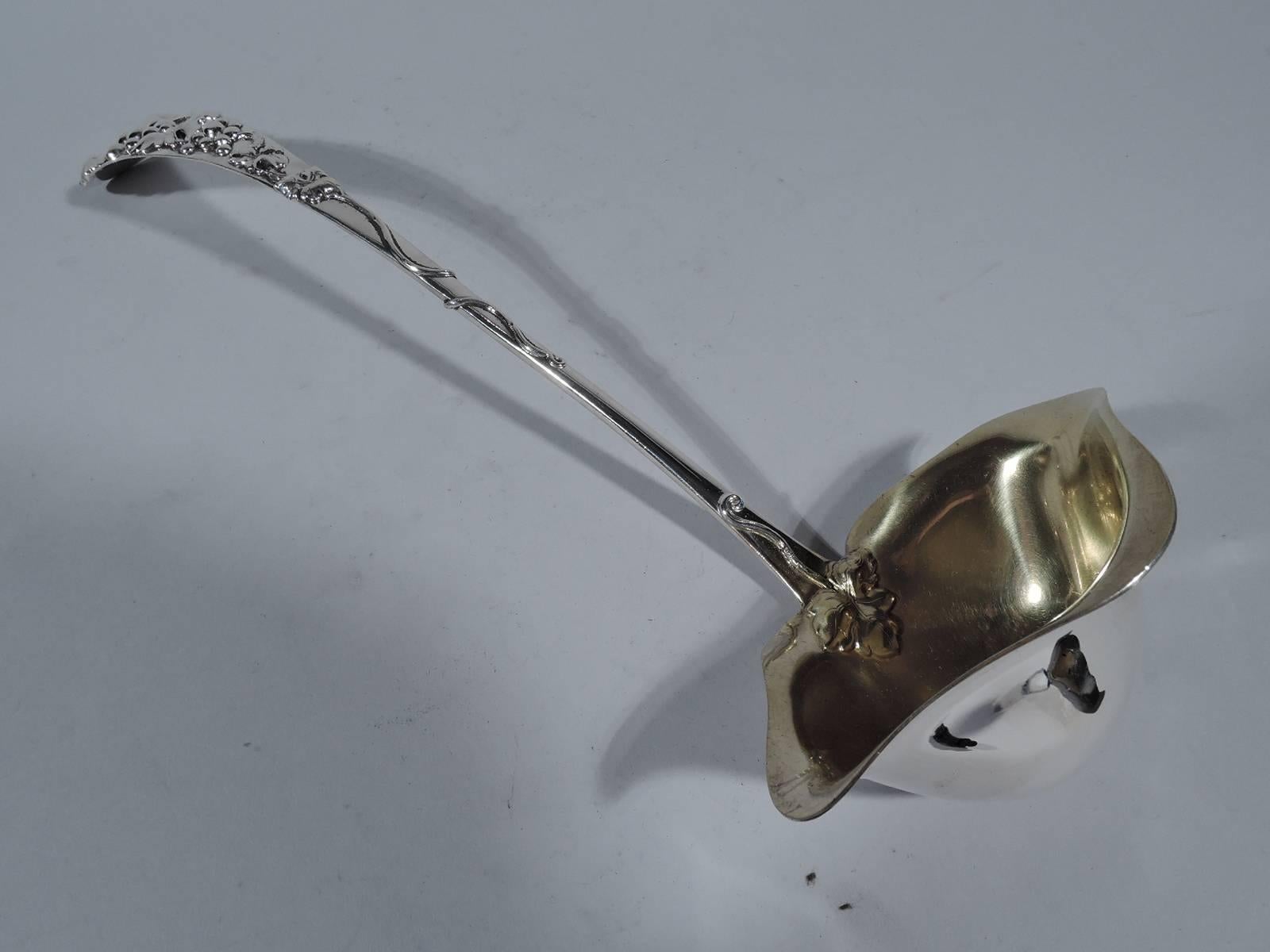 Sterling silver punch ladle. Made by Frank Smith in Gardner, Mass., circa 1900. Tapering handle with applied fruiting grapevine. Bowl has light gilt wash and front and side spouts. A great piece for festive grape-based concoctions. Hallmarked. Nice