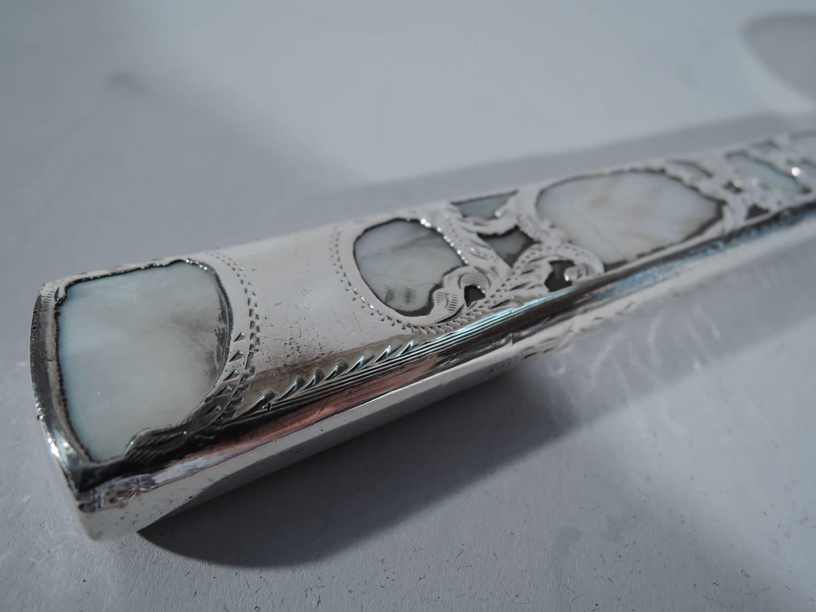 Antique magnifying glass, circa 1900. Tapering mother-of-pearl handle overlaid with silver scrollwork. Circular lens in metal frame. Handle marked 