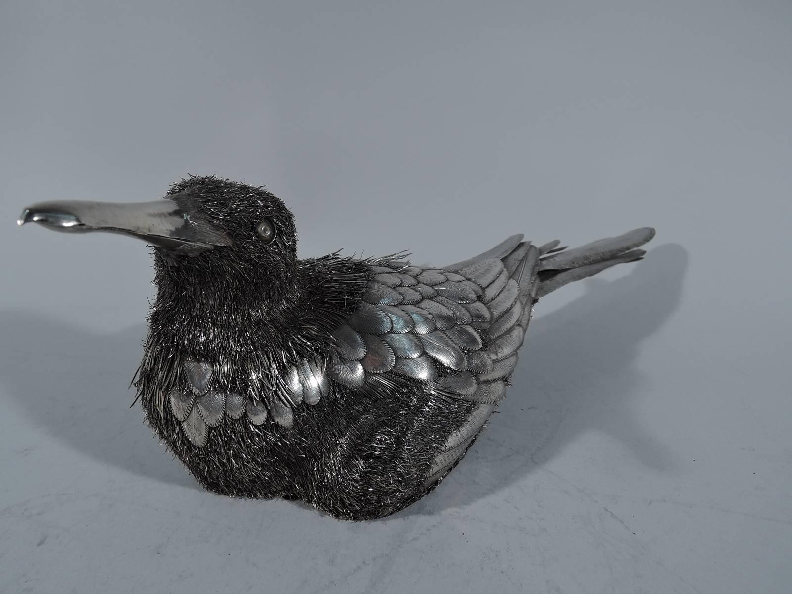 Nesting duck figure in 800 silver. Made by Mario Buccellati in Milan, circa 1930s. The bird is in full tucked-down mode with wings close to body. Engraved and overlapping feathers on body and tail as well as bristly wire feathers on neck, head, and