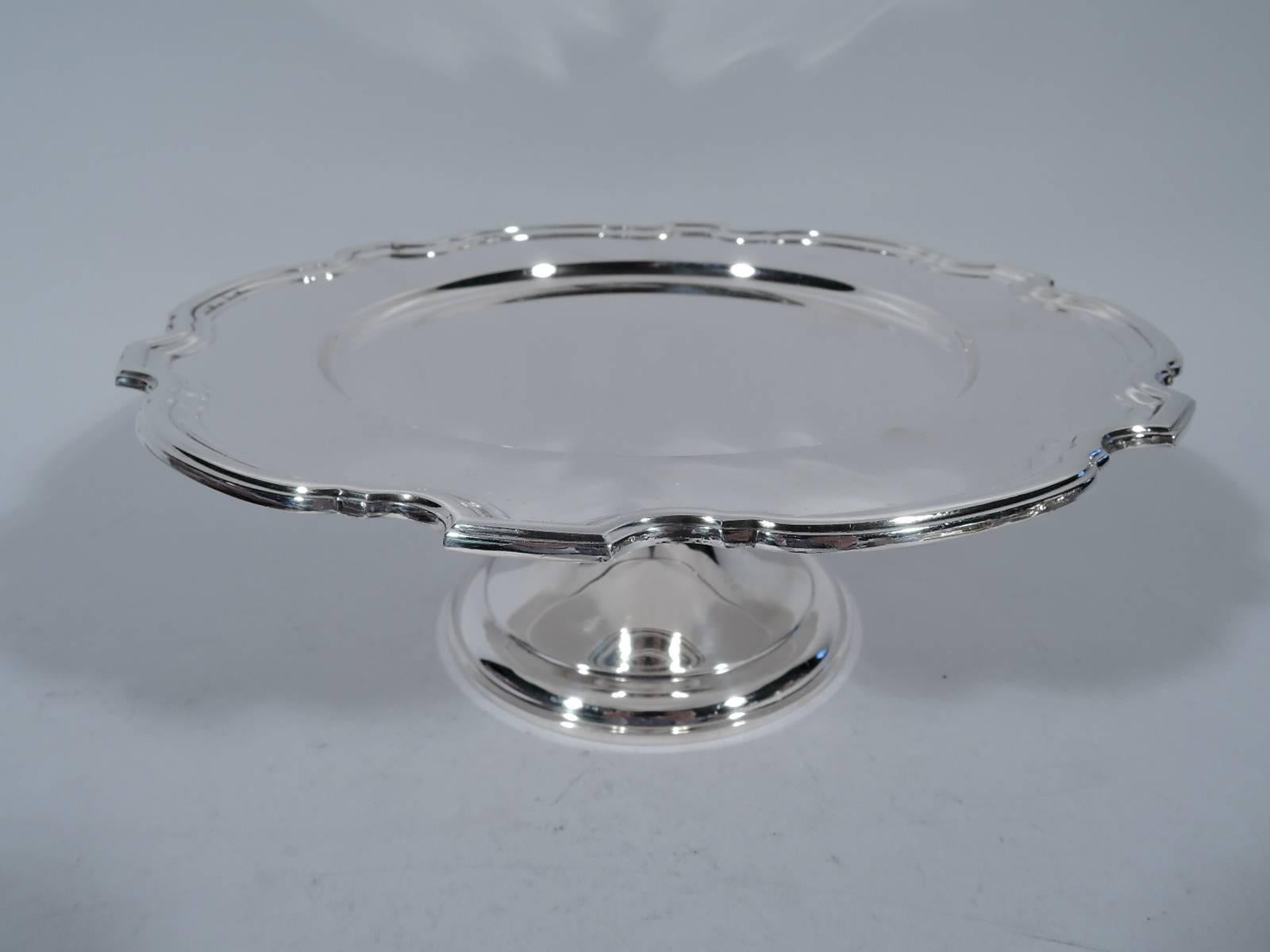 Sweet sterling silver compote. Made by Tiffany & Co. in New York. Shallow well and molded curvilinear rim. An old-fashioned design with a suggestion of the Georgian piecrust motif. Hallmark includes pattern no. 23065 and director’s letter M