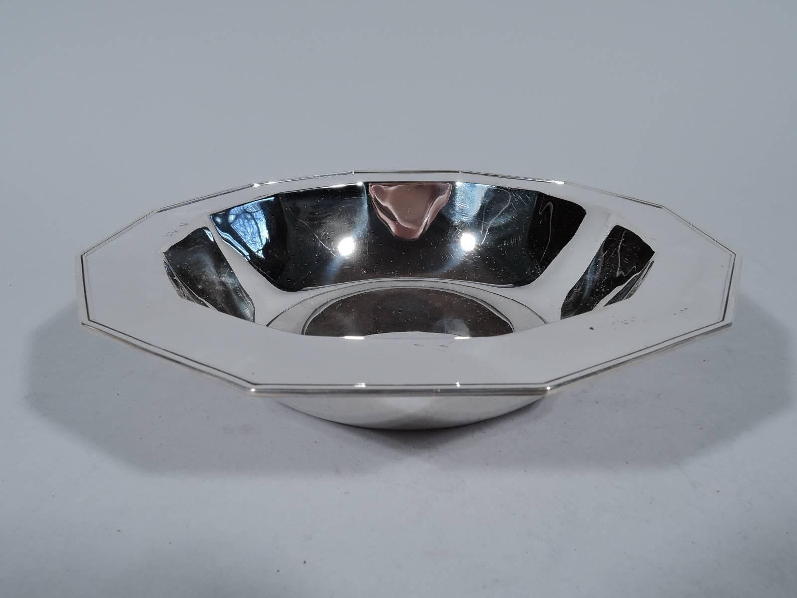 Art Deco bowl. Made by Tiffany & Co. in New York, circa 1910. Circular well, tapering and faceted sides, and flat, molded, and faceted rim. Hallmark includes pattern no. 17717 (first produced in 1910) and director’s letter m (1907-47). Weight: 9.7