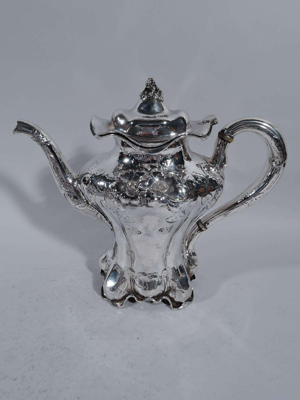 Art Nouveau sterling silver coffee and tea set. Made by Black, Starr & Frost & in New York, circa 1890. This set comprises coffeepot, teapot, creamer, sugar and waste bowl.

Each: Baluster body with wavy rim and raised and wavy foot. Visible hand