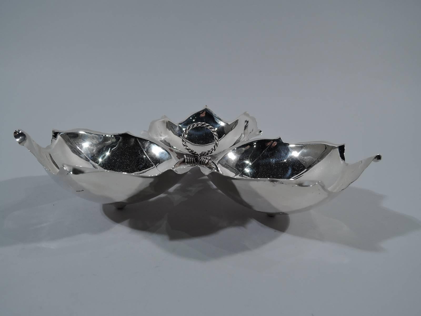 Sterling silver three-leaf dish. Made by Alfredo Sciarrotta in Newport, Rhode Island. Three leaf-form bowls with veins and irregular points tied together with wire. A Classic Midcentury design. Hallmark includes retailer’s name Shreve, Crump & Low,
