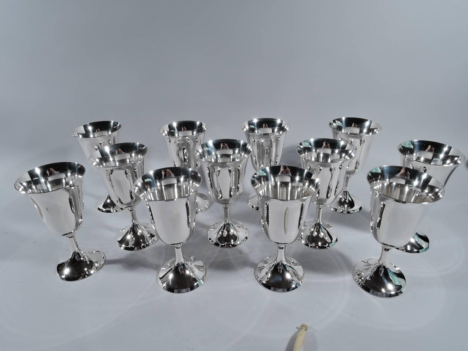 Twelve sterling silver goblets. Made by Stieff in Baltimore, 1950s-1960s. Each: Tall and tapering bowl with flared rim, stem, and raised foot. A great all-purpose set for formal dinners and last-minute brunches. Hallmark includes no. 0801 and date