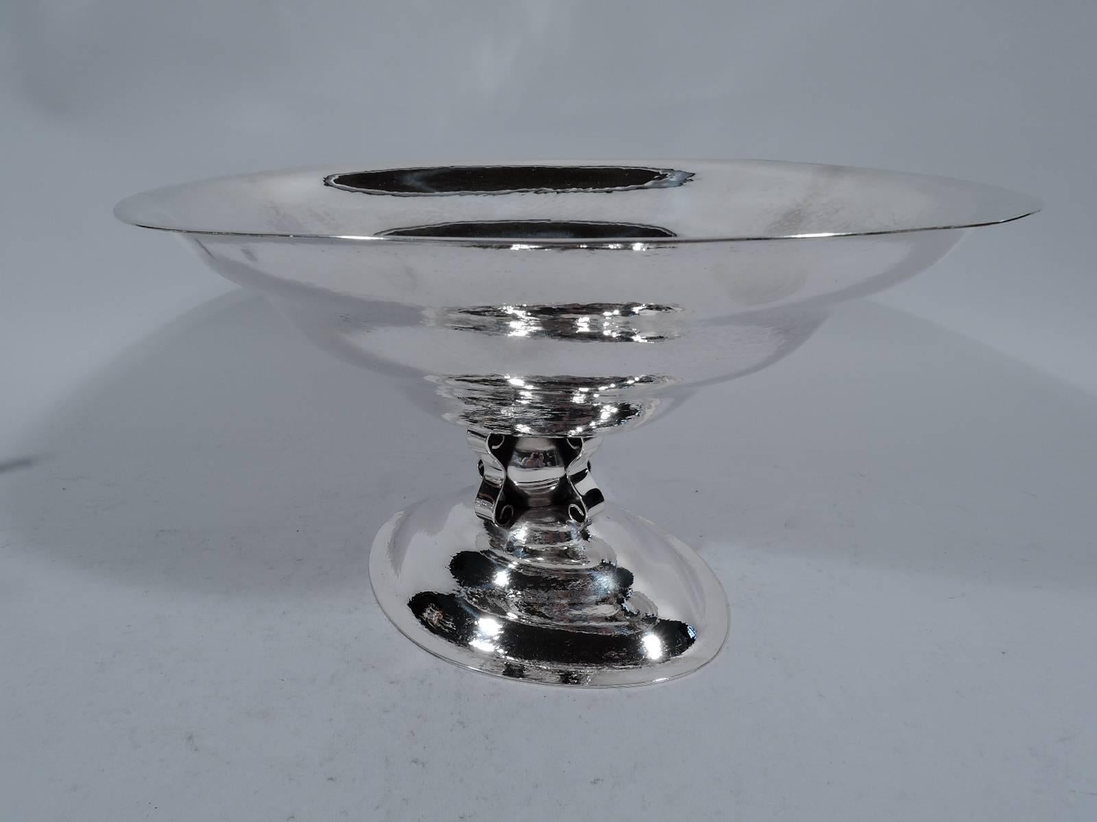 Sterling silver bowl. Made by Reed & Barton in Taunton, Mass. in 1929. Oval and stepped bowl on globular support applied with 4 frivolous scrolls and mounted to stepped oval foot. Modernized Craftsman. Hammered shimmering. Hallmark includes no. 1000