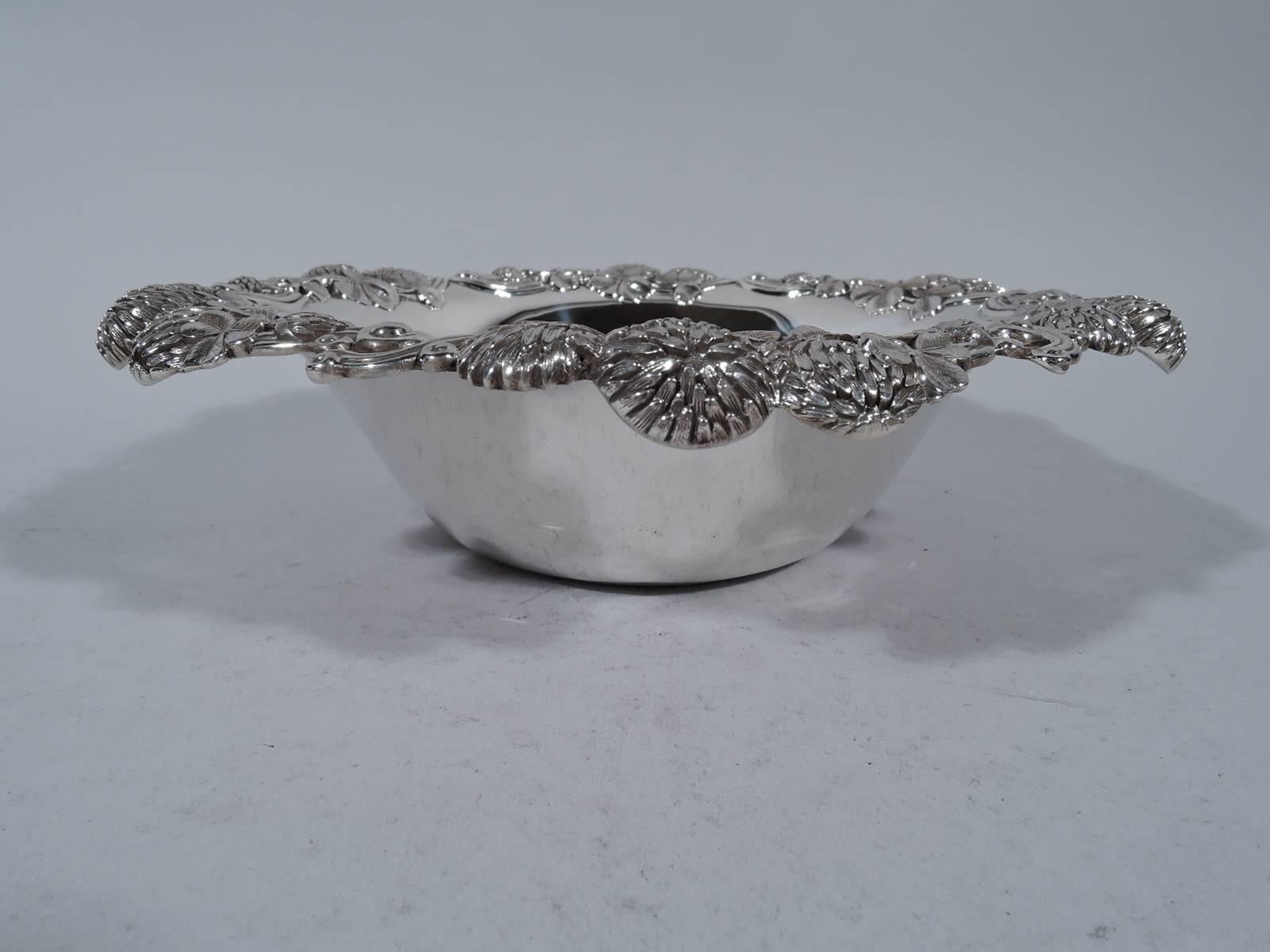Sterling silver bowl in clover pattern. Made by Tiffany & Co. in New York, circa 1898. Tapering sides and turned-down rim with bunched blossoms. An early piece in this pattern. Hallmark includes pattern no. 13780 (first produced in 1898) and