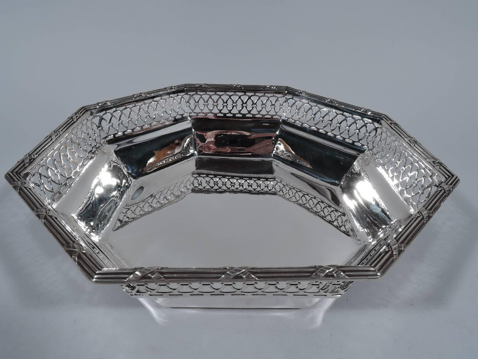 Edwardian sterling silver bowl. Retailed by Tiffany & Co. in New York, circa 1910. Solid octagonal well and tapering sides. Top sides have pierced and interlaced ornament. Reeded rim. Hallmark includes no. 881. Weight: 13 troy ounces.