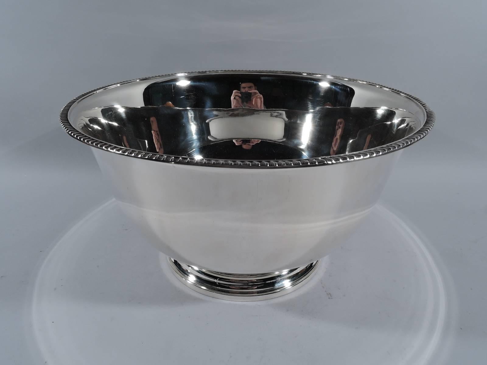Large sterling silver centerpiece bowl. Retailed by Georg Jensen Inc. USA in New York, ca 1950. Curved sides with gadrooned rim and stepped foot. The traditional form in large scale. A great trophy or presentation piece with lots and lots of room