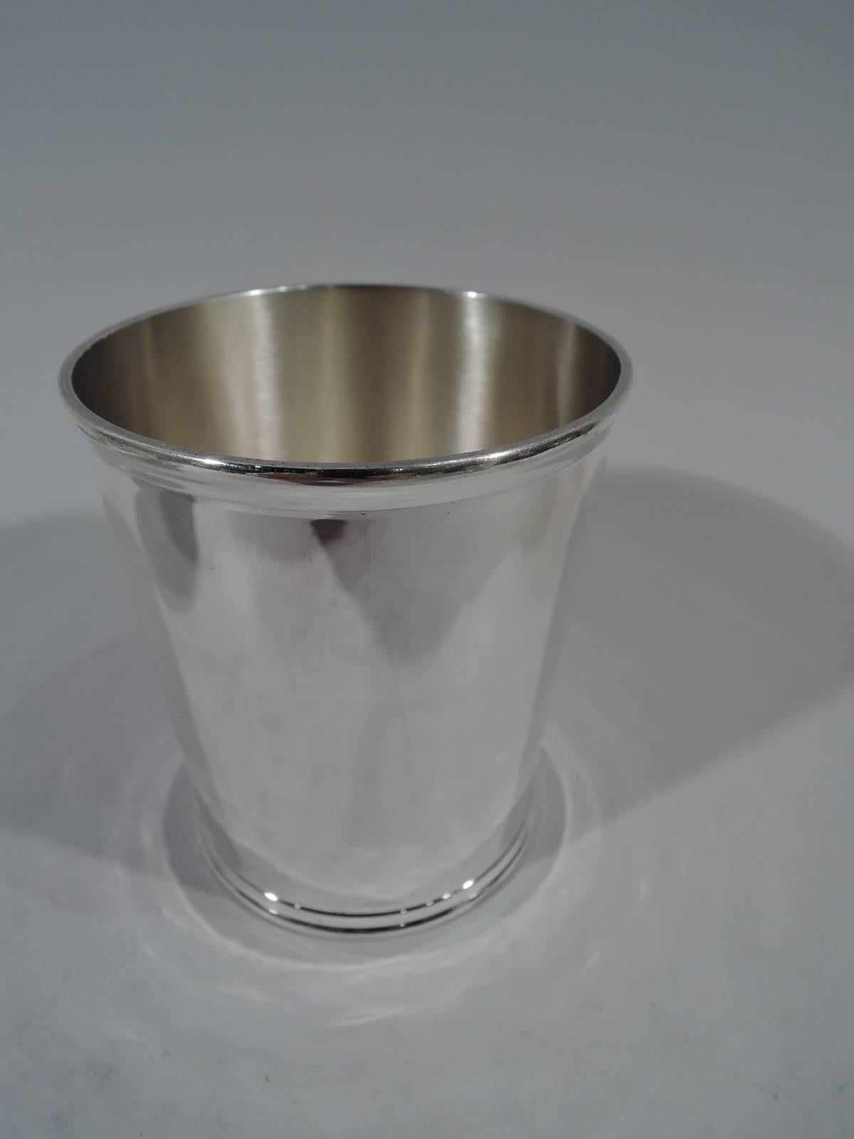 Set of six sterling silver mint julep cups. Made by Stieff in Baltimore in 1920. Each: Straight and tapering sides and molded rims. Nice and old, and fully serviceable for dozens more Derby days. Hallmark includes date symbol. Measure: Total weight