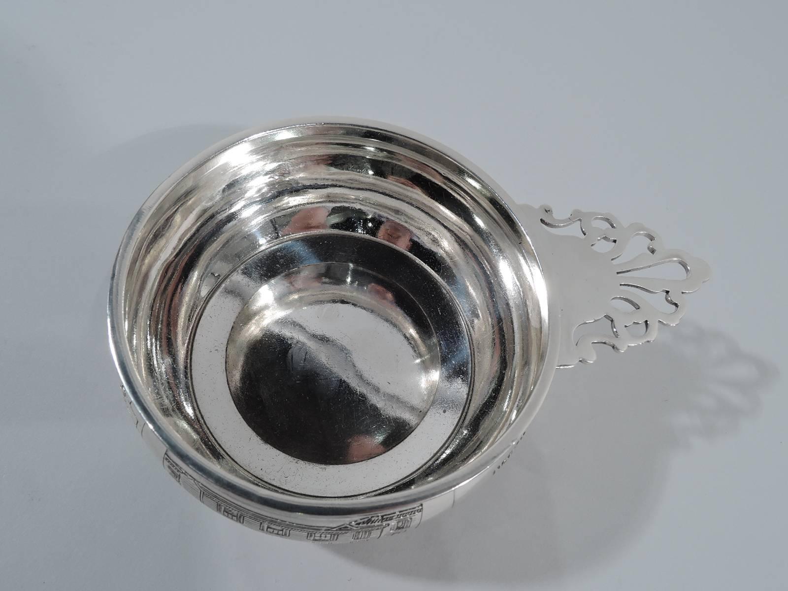 Sterling silver novelty porringer. Made by McChesney in Newark, circa 1910. Curved sides with acid-etched frames depicting the midnight ride of Paul Revere, when he announced “The British are coming.” Revere’s house, the North Church, and crossing