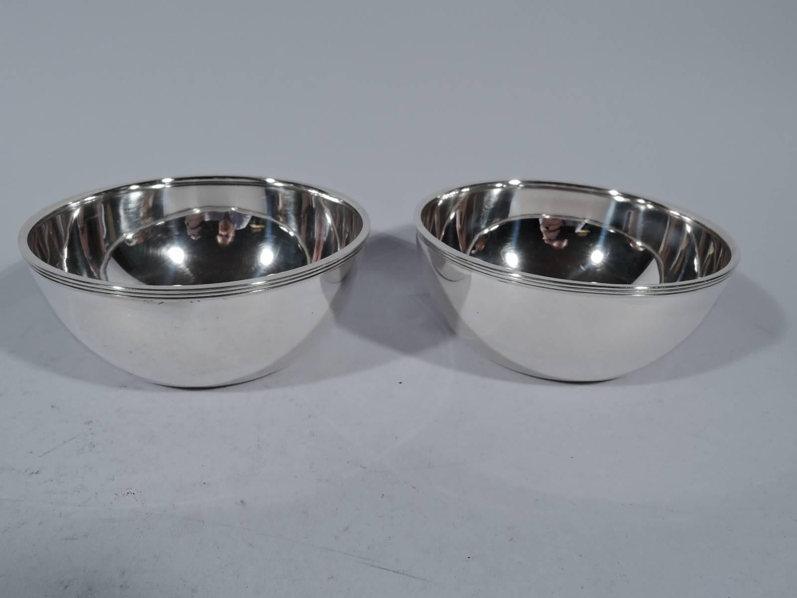 Set of ten sterling silver dessert bowls. Made by Gorham in Providence, circa 1910. Each: Curved sides and reeded rim. Hallmarked with pattern no. A7376 or 7376. Total weight: 26 troy ounces.