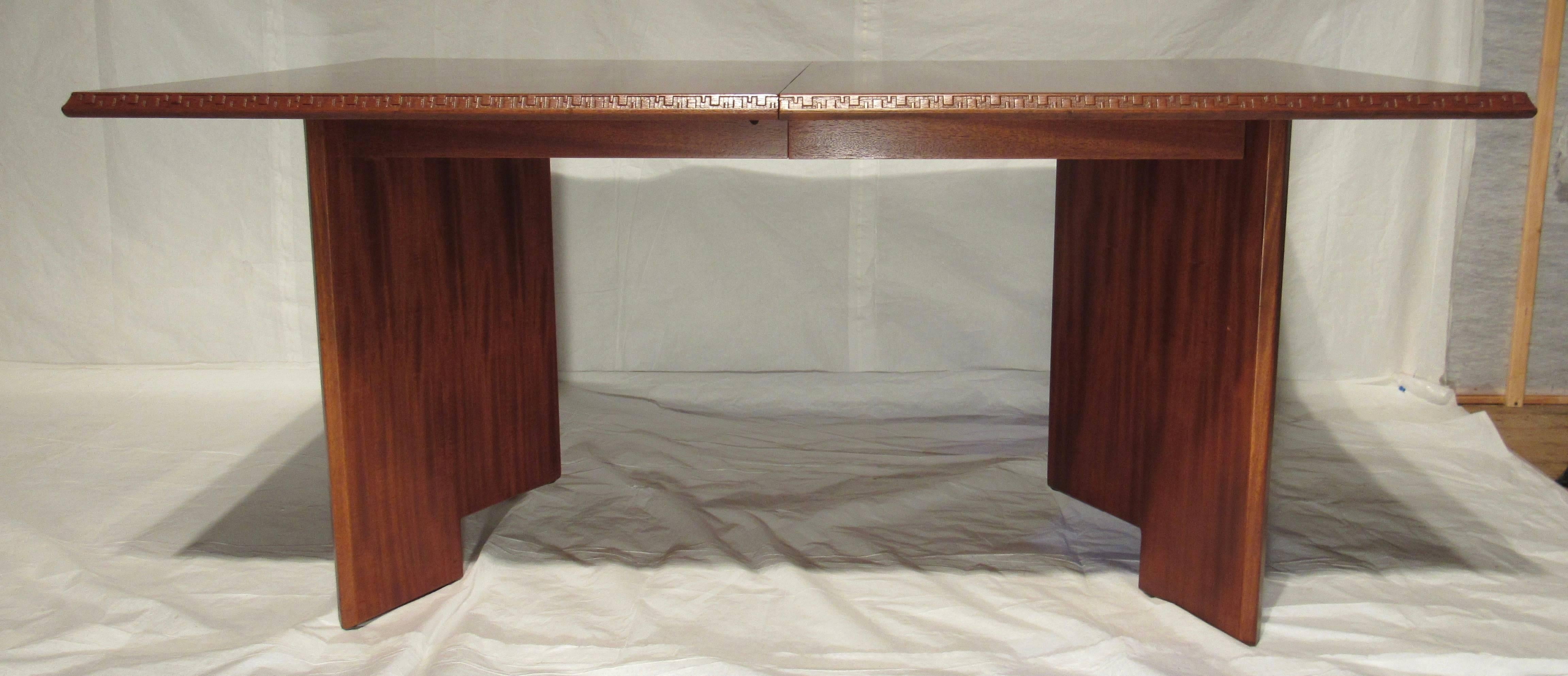 A mahogany dining table designed by Frank Lloyd Wright as part of his Taliesin line of furniture manufactured by Heritage Henredon between 1955-1956.
A very versatile table with (two) 18 inch leaves thus extending the 66 inch table to 102 inches