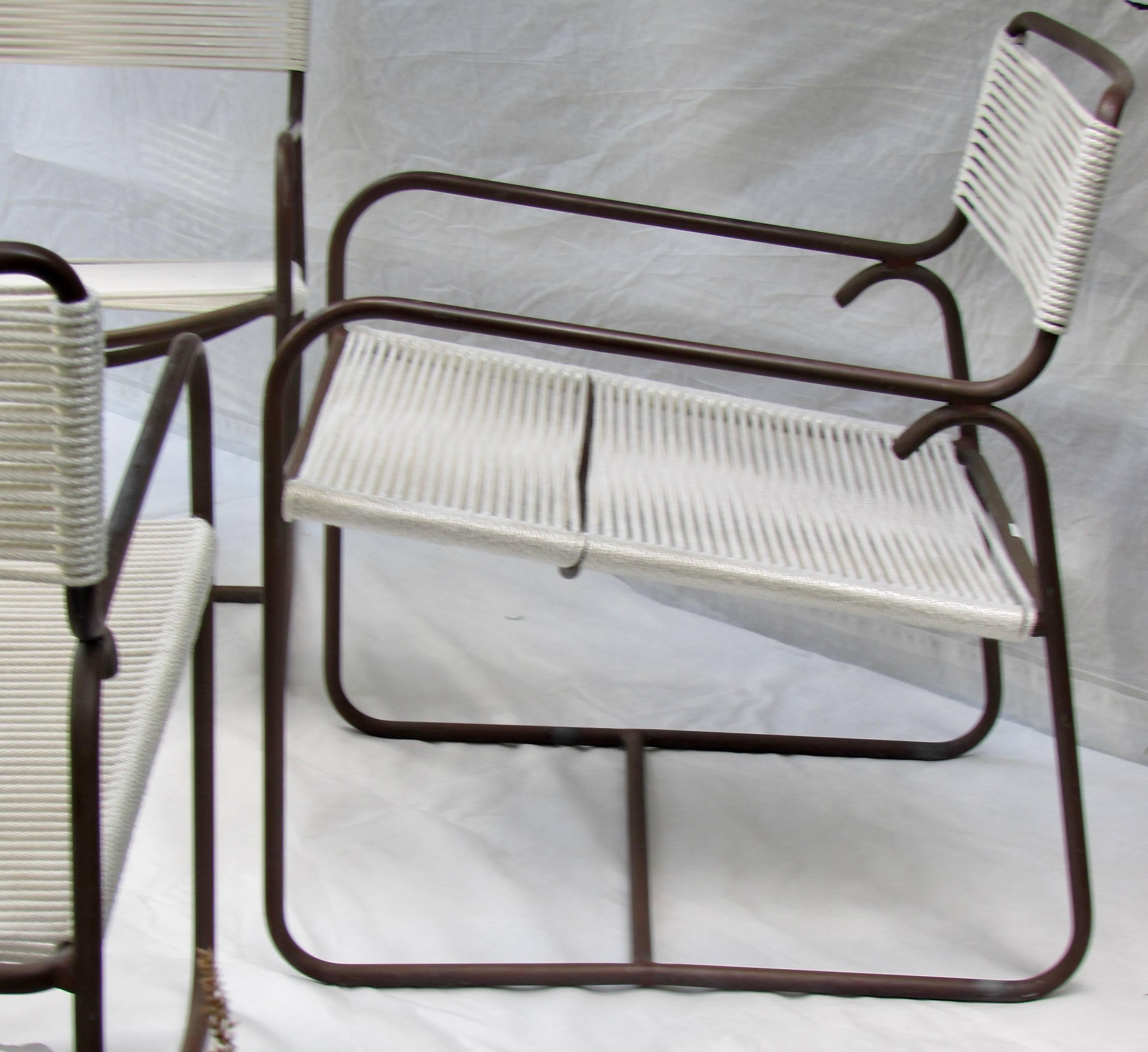 Four Walter Lamb Bronze lounge chairs for Brown Jordan originally purchased in 1958. 
The chairs are constructed from steel tube jacketed in naval bronze and are considered classic mid century icons. 
Pieces from this line of furniture received