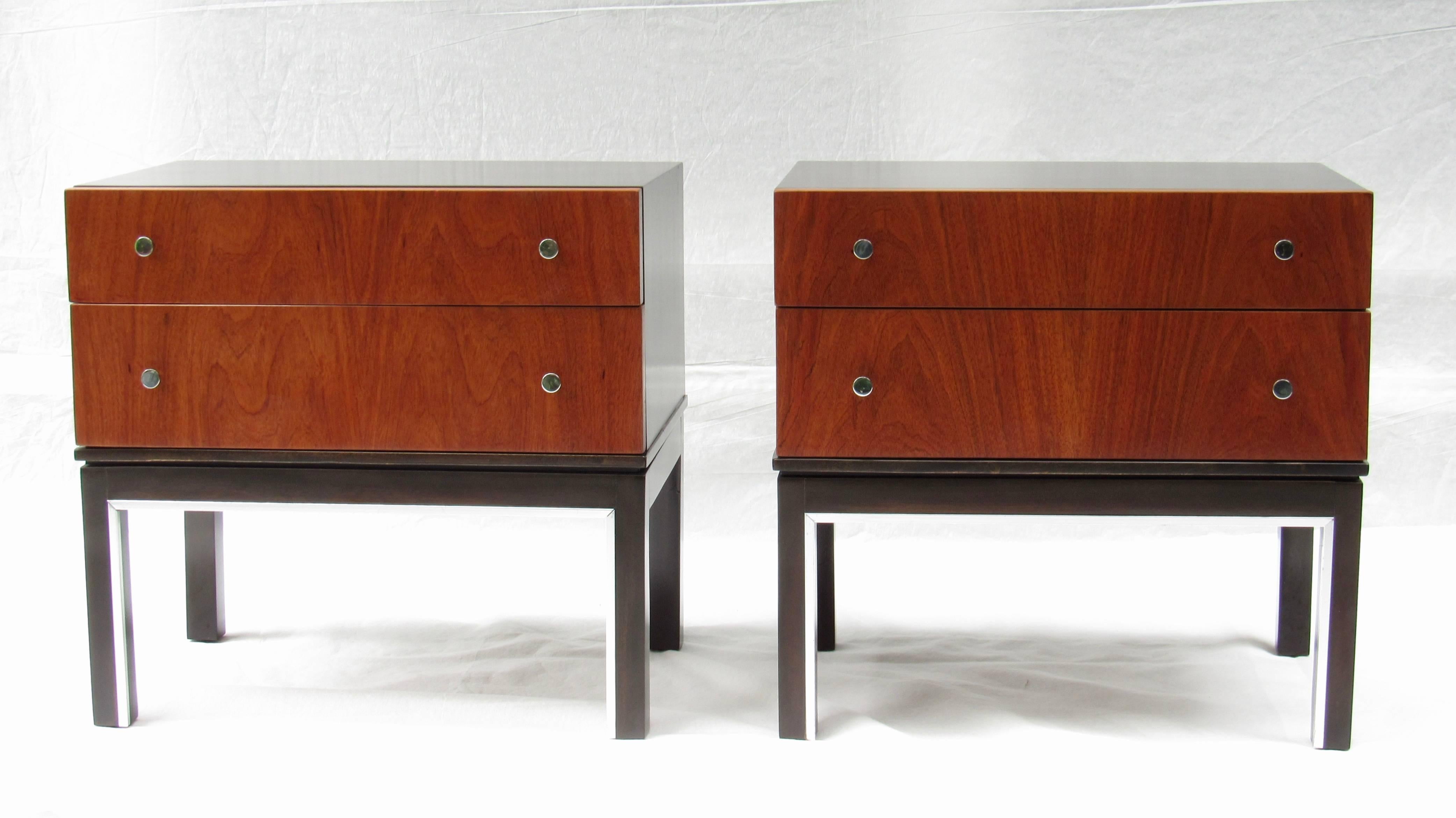 A striking pair of walnut end tables / nightstands designed by Merton Gershun for American of Martinsville in the early 1960s.
The bases have inset chrome accents.
Both pieces are stamped American of Martinsville inside the upper drawer.
The pair