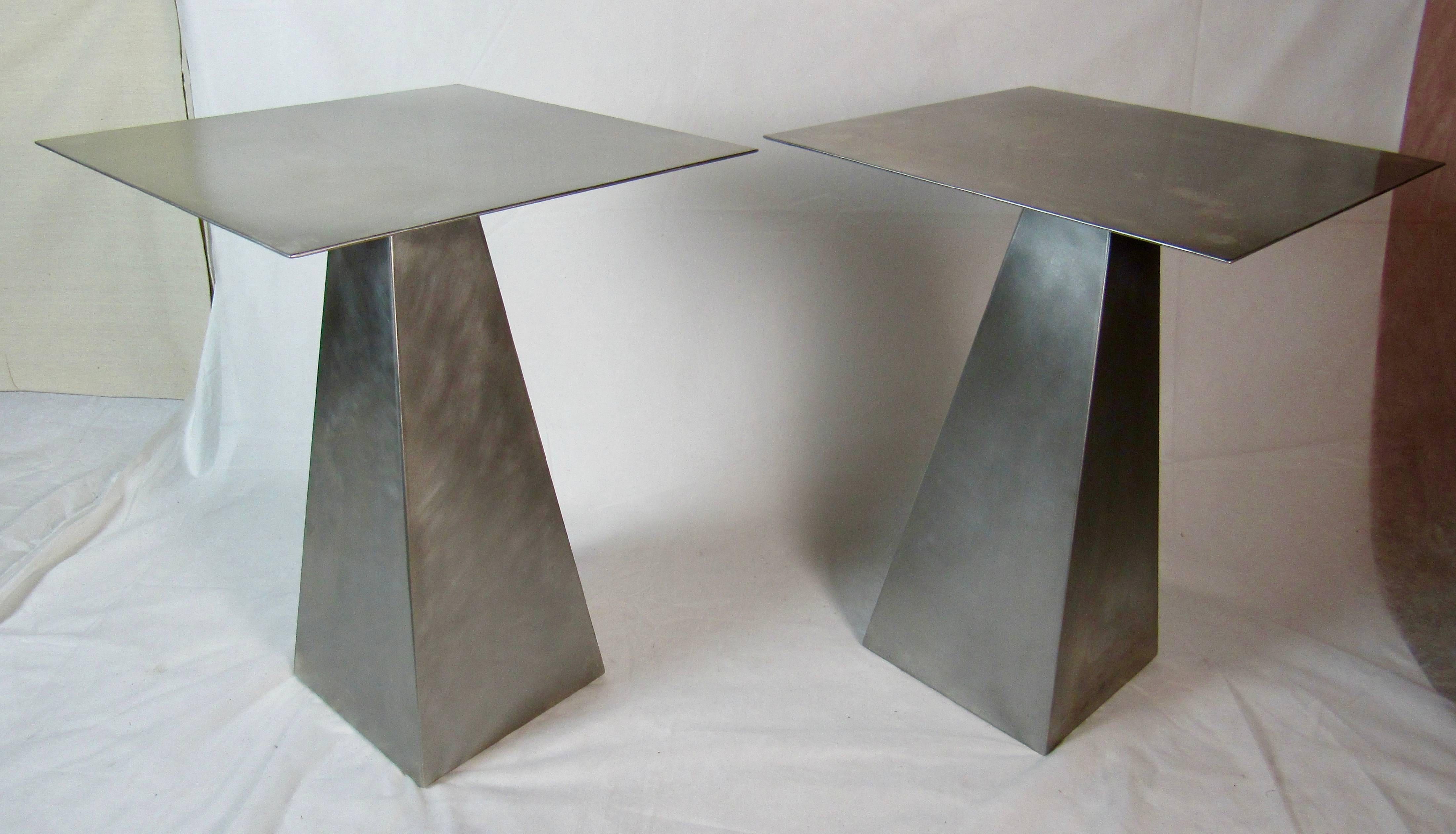 A pair of brushed stainless steel end tables that resemble Harvey Probber's pyramid based side tables. I was told the tables date from the 1980s.
They are in excellent vintage condition.