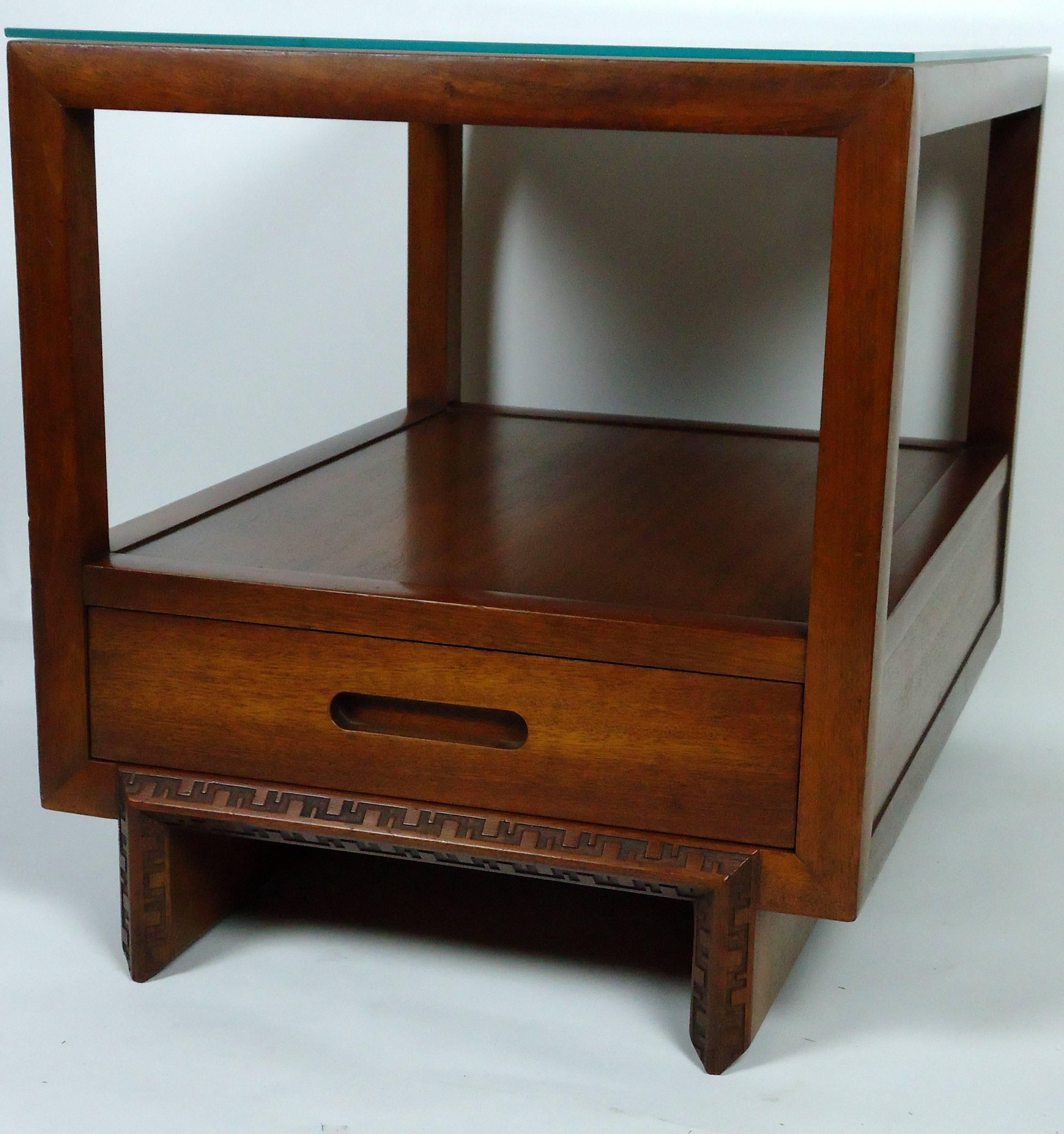 An elegant matched pair of Frank Lloyd Wright mahogany veneered end tables or nightstands. Manufactured i September of 1955 by Henredon Heritage model 450-E part of Wright's Taliesin line.
Both pieces are stamped with the Wright signature and