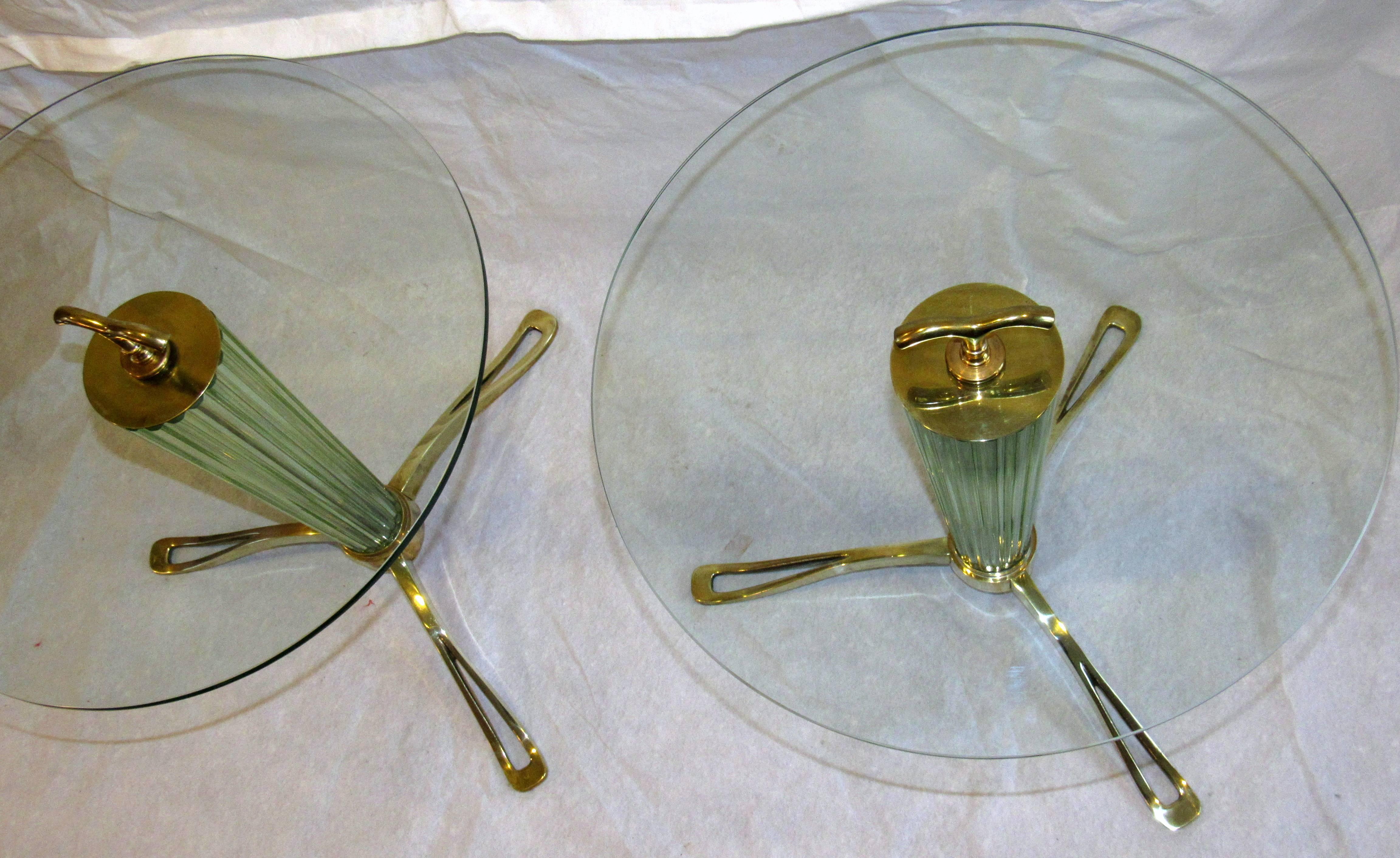 A rare pair of fluted Murano glass end tables / gueridons in the style of Fontana Arte circa 1958.
The heavy fluted hollow glass cones are held on beautifully cast polished brass tripod bases 
The tables are in excellent vintage condition with one