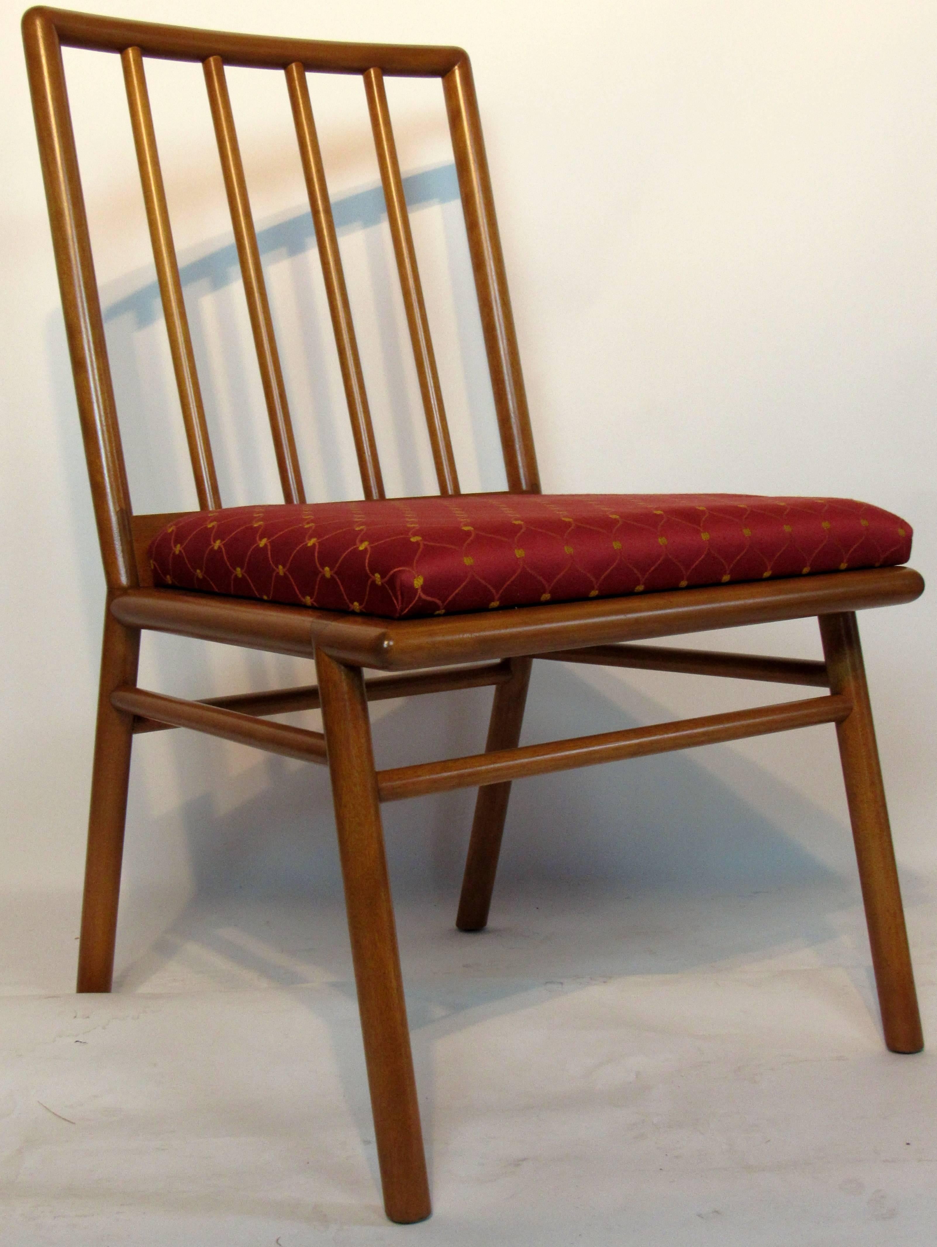 T.H. Robsjohn-Gibbings set of six walnut spindle back dining chairs for Widdicomb, circa 1952.
The chairs are in excellent condition with original upholstery.