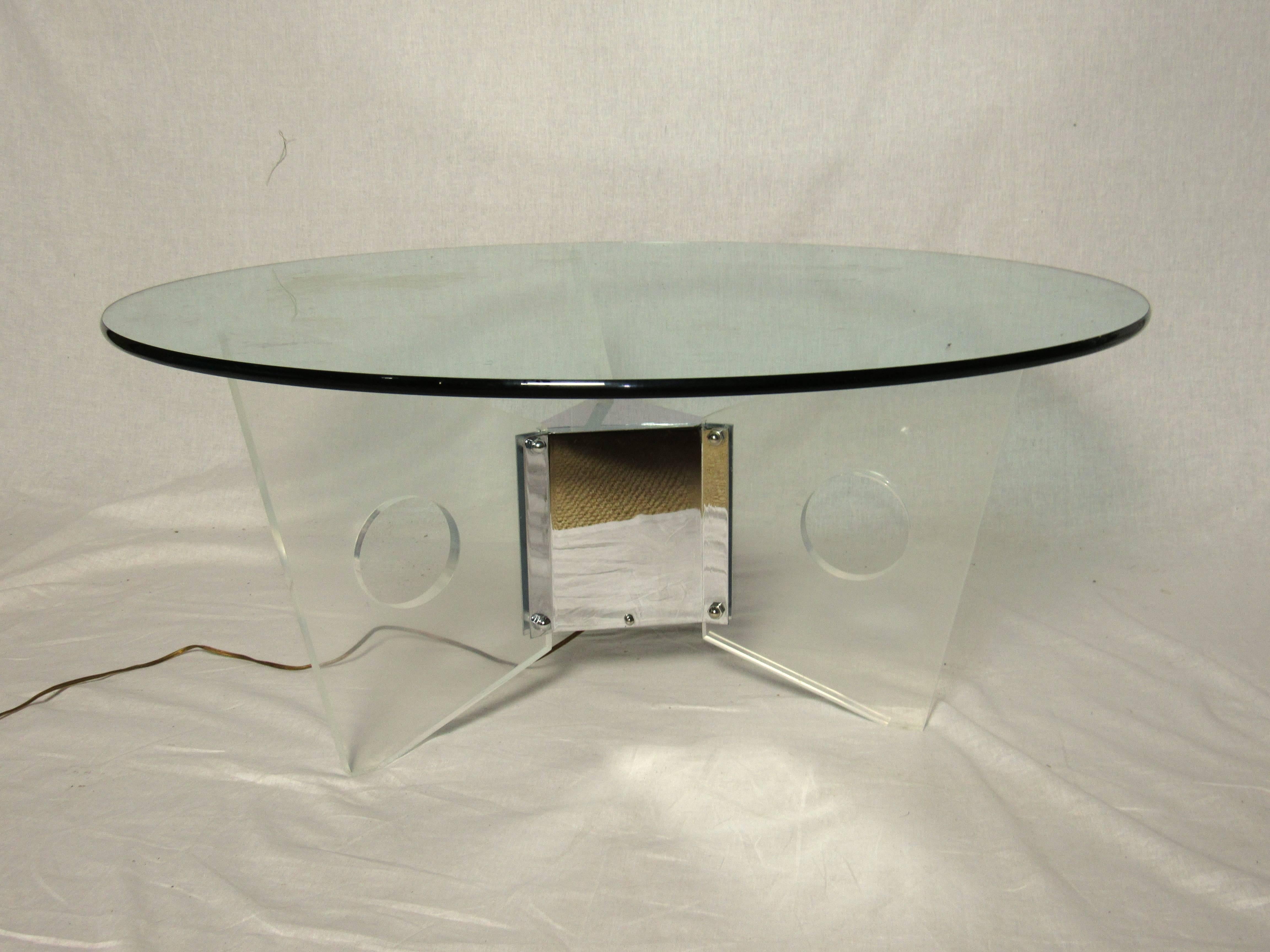 Wonderful light up coffee table which can be lit by any color bulb or just a clear bulb to accentuate the Lucite fins.
Very cool, Studio 54, bright lights, Big City, Miami Vice.
The table is in excellent condition.