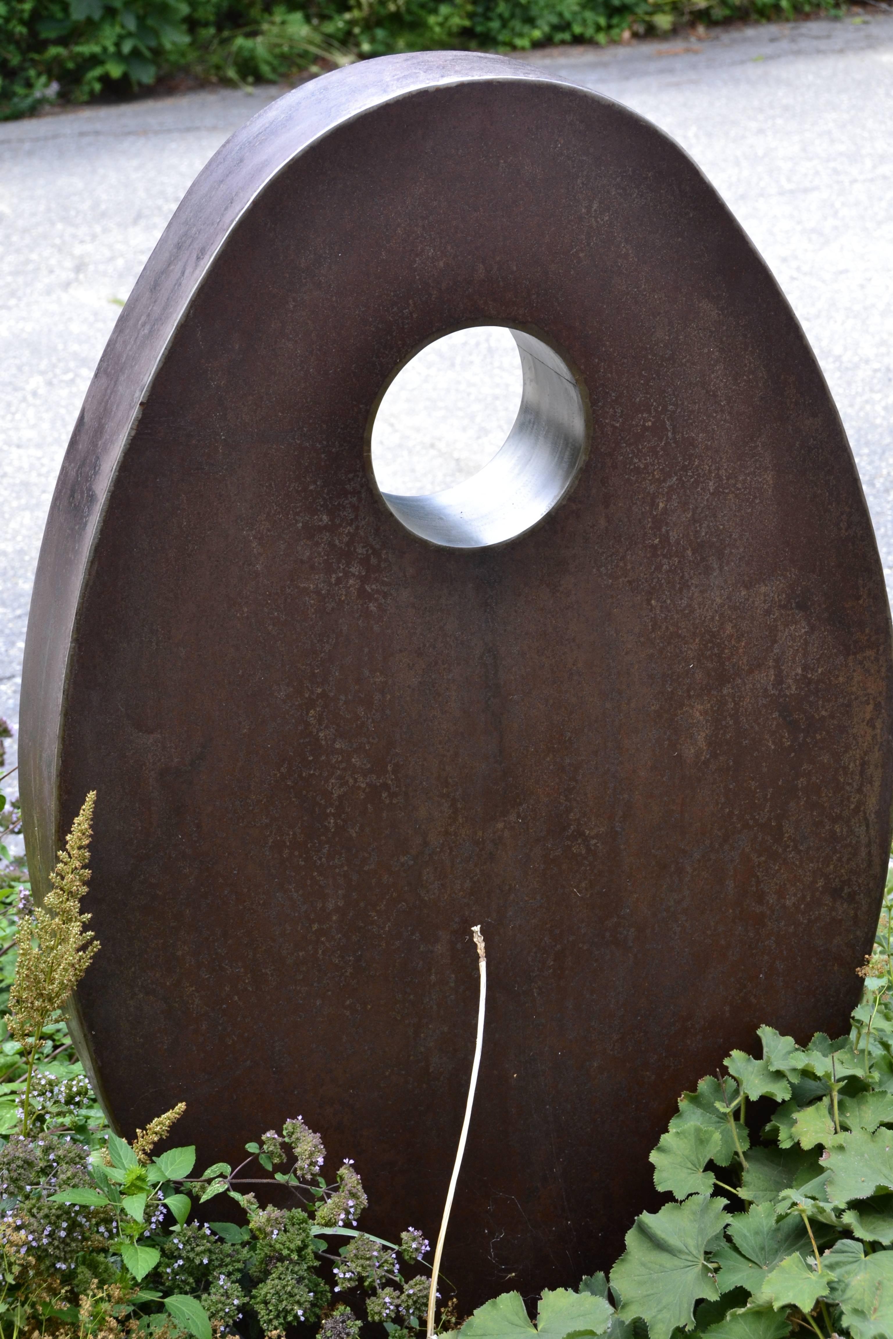 A pair of Jean Arp influenced corten steel outdoor sculpture titled;The Odd Couple by 
New York sculptor Jim Harvey, circa 1970.
The corten steel sculptures each have an inset ring of stainless steel.
The larger sculpture measures:
72 inches x 16.5