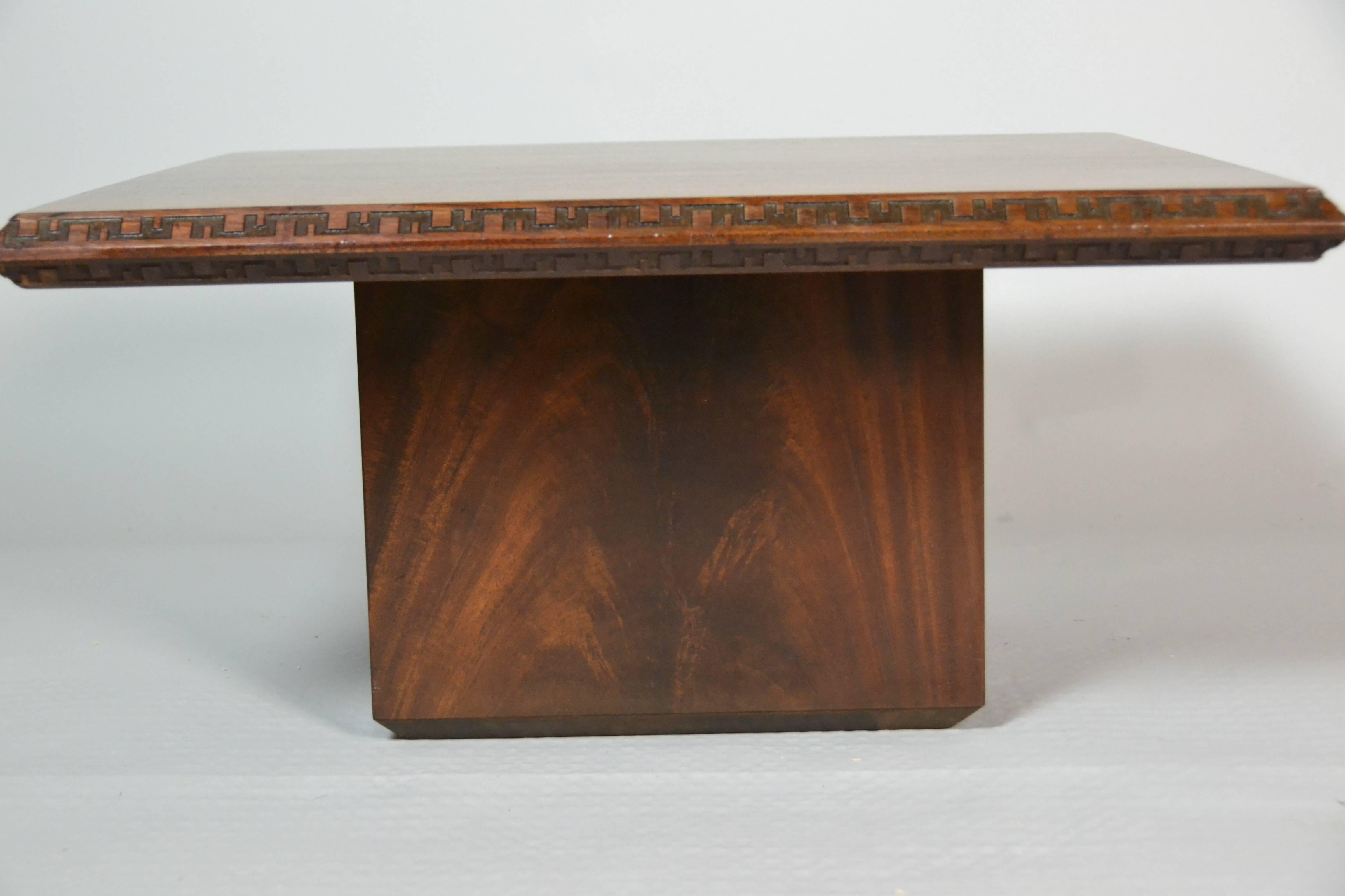 A Frank Lloyd Wright mahogany coffee table or end table designed by  for Heritage Henredon for their Taliesin line introduced in 1955.
The table is in excellent condition.
 