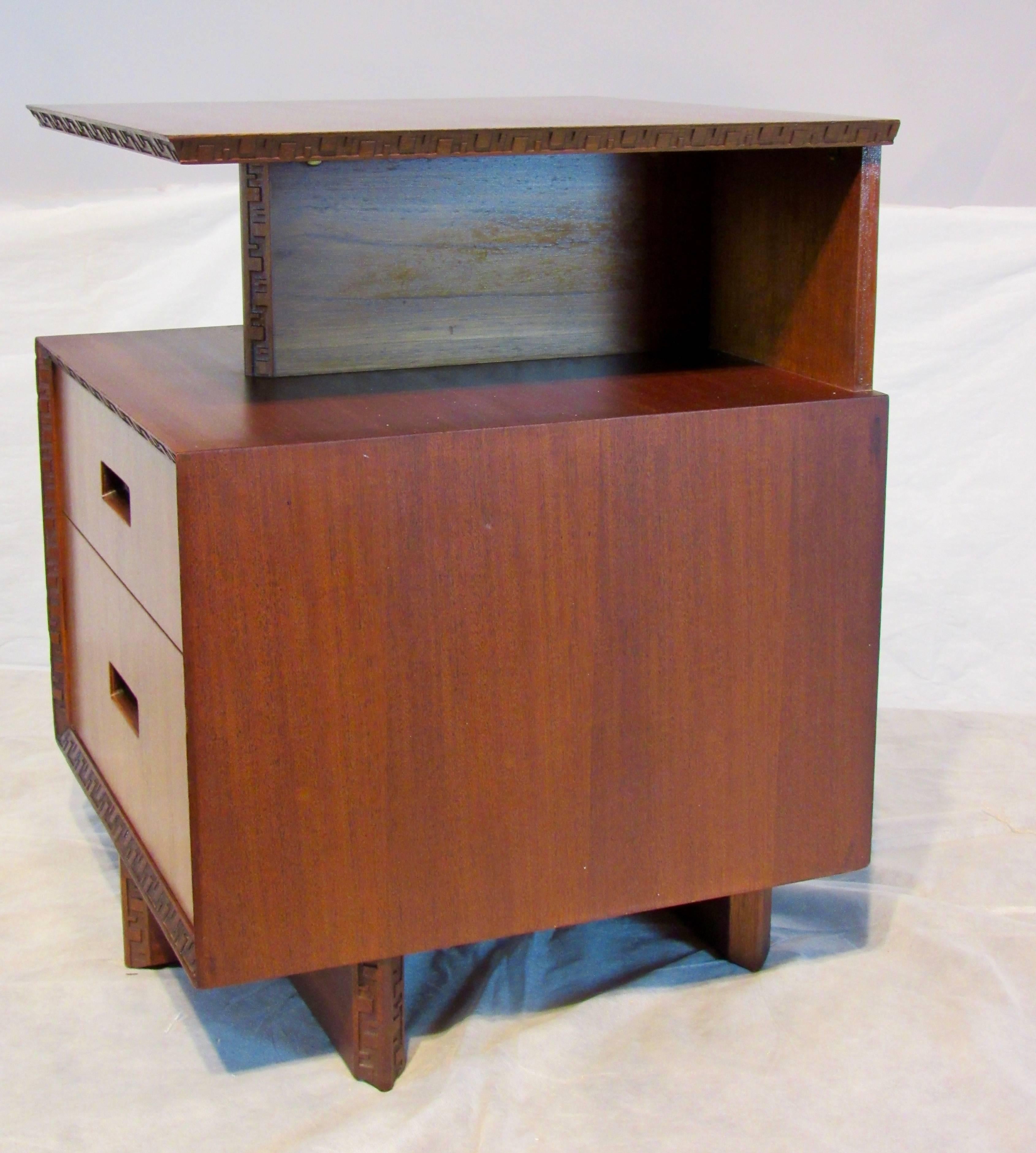 Frank Lloyd Wright mahogany nightstand or end table designed for his Taliesin line of furniture manufactured by Heritage Henredon in the mid-1950s.
A storage table that is very sculptural.
The table has been carefully conserved and is in excellent