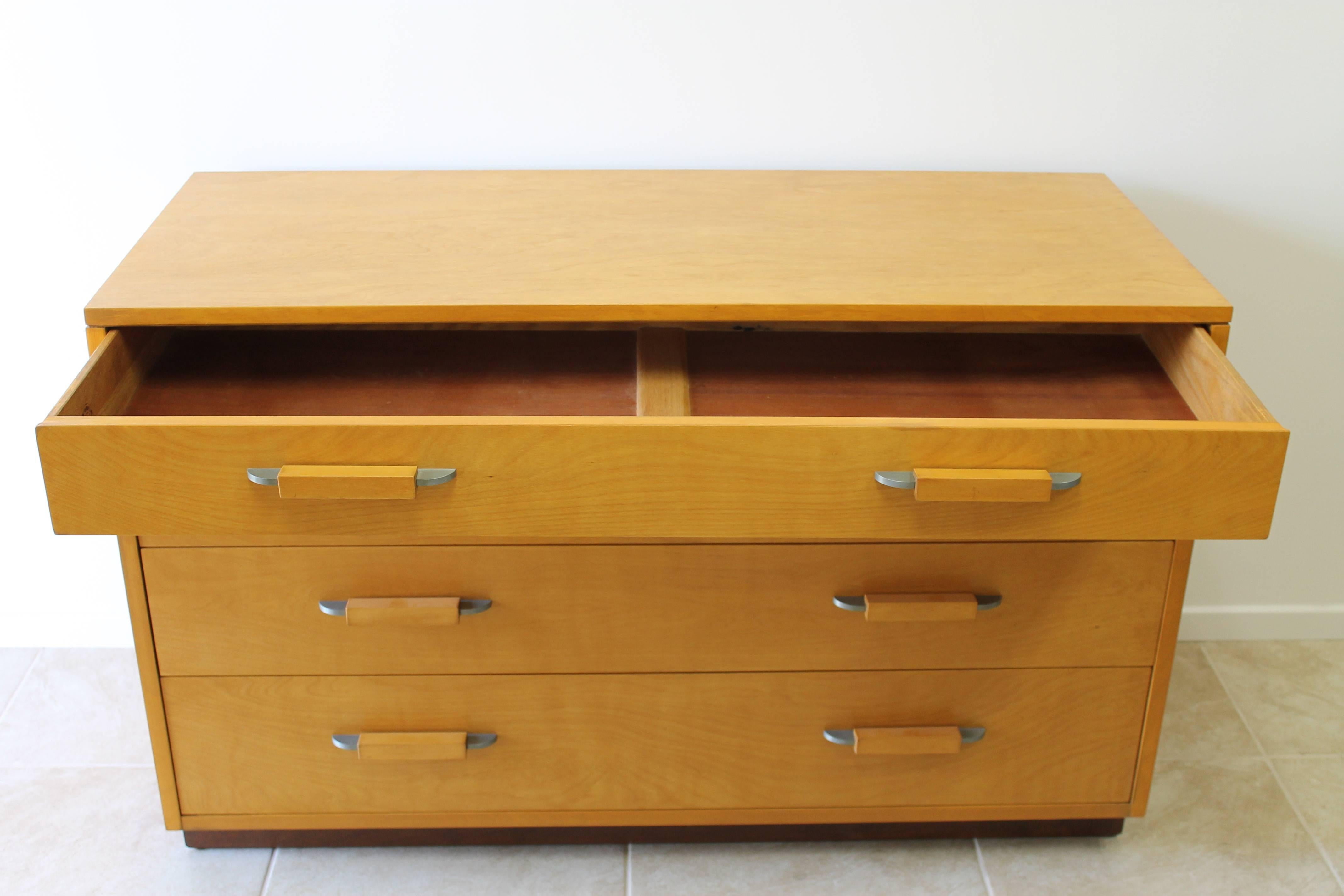 Four-drawer dresser by Eliel Saarinen and Pipsan Saarinen Swanson for the Johnson Furniture Co. Branded on top drawer signed with branded manufacturer's mark to reverse: (Johnson Furniture Co. Grand Rapids, Michigan). Dresser has been professionally