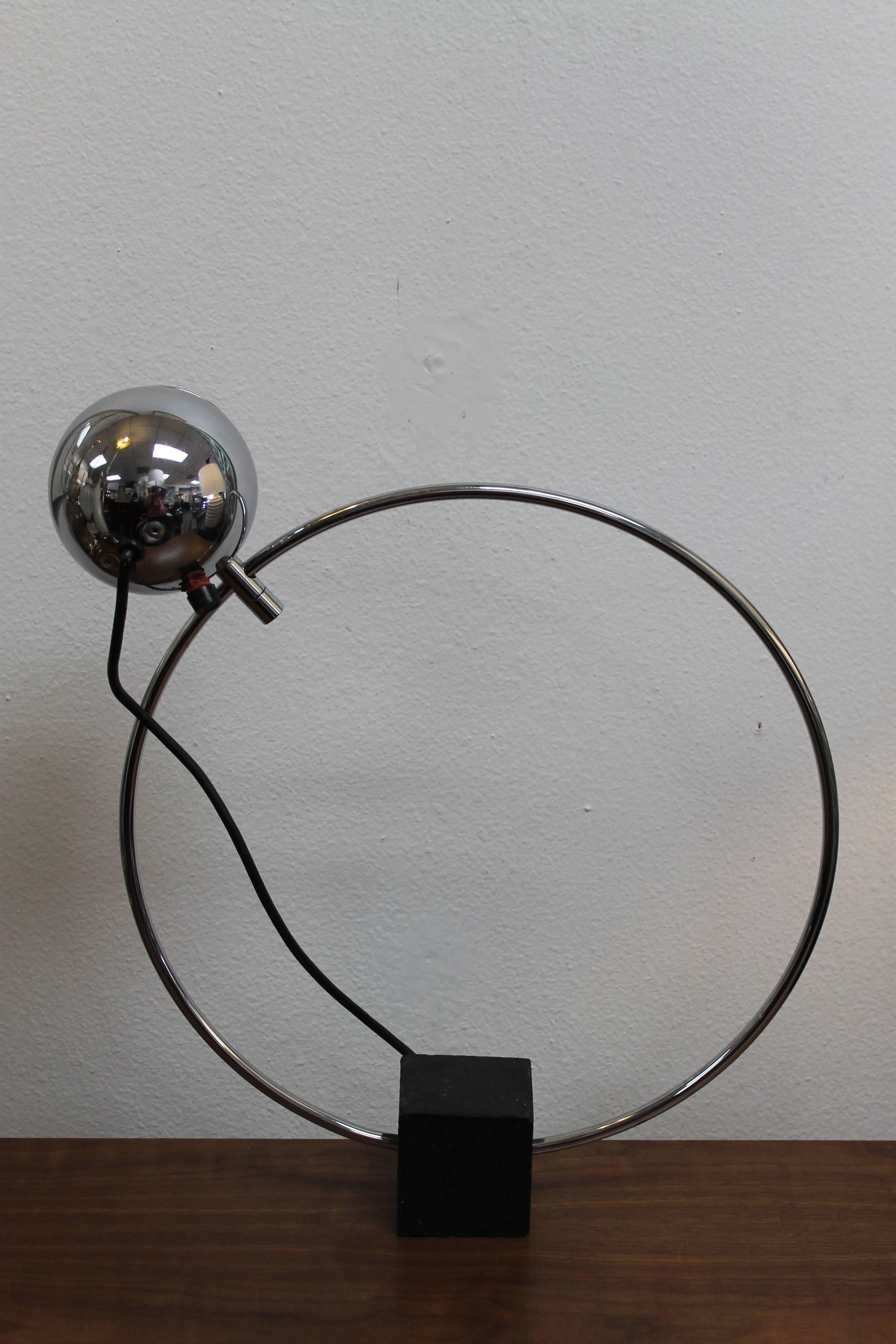 Kovacs table lamp, attributed to Robert Sonneman. Chrome-plated steel, enameled steel base. Measures: 16” diameter. Base is 3” wide, deep and high. Total height is 17.5