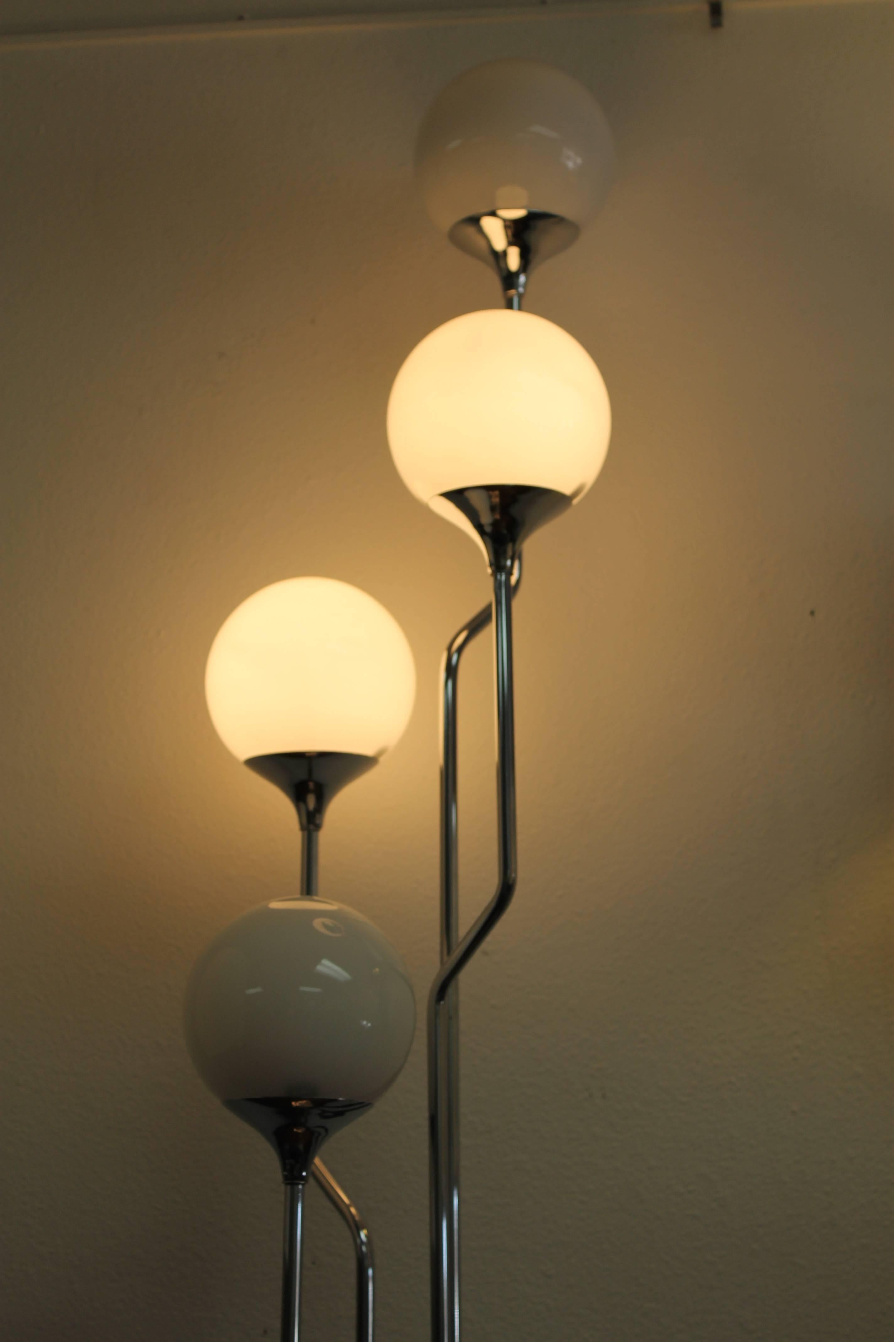 Chrome and four glass globes Italian floor lamp by Goffredo Reggiani. Measures 65