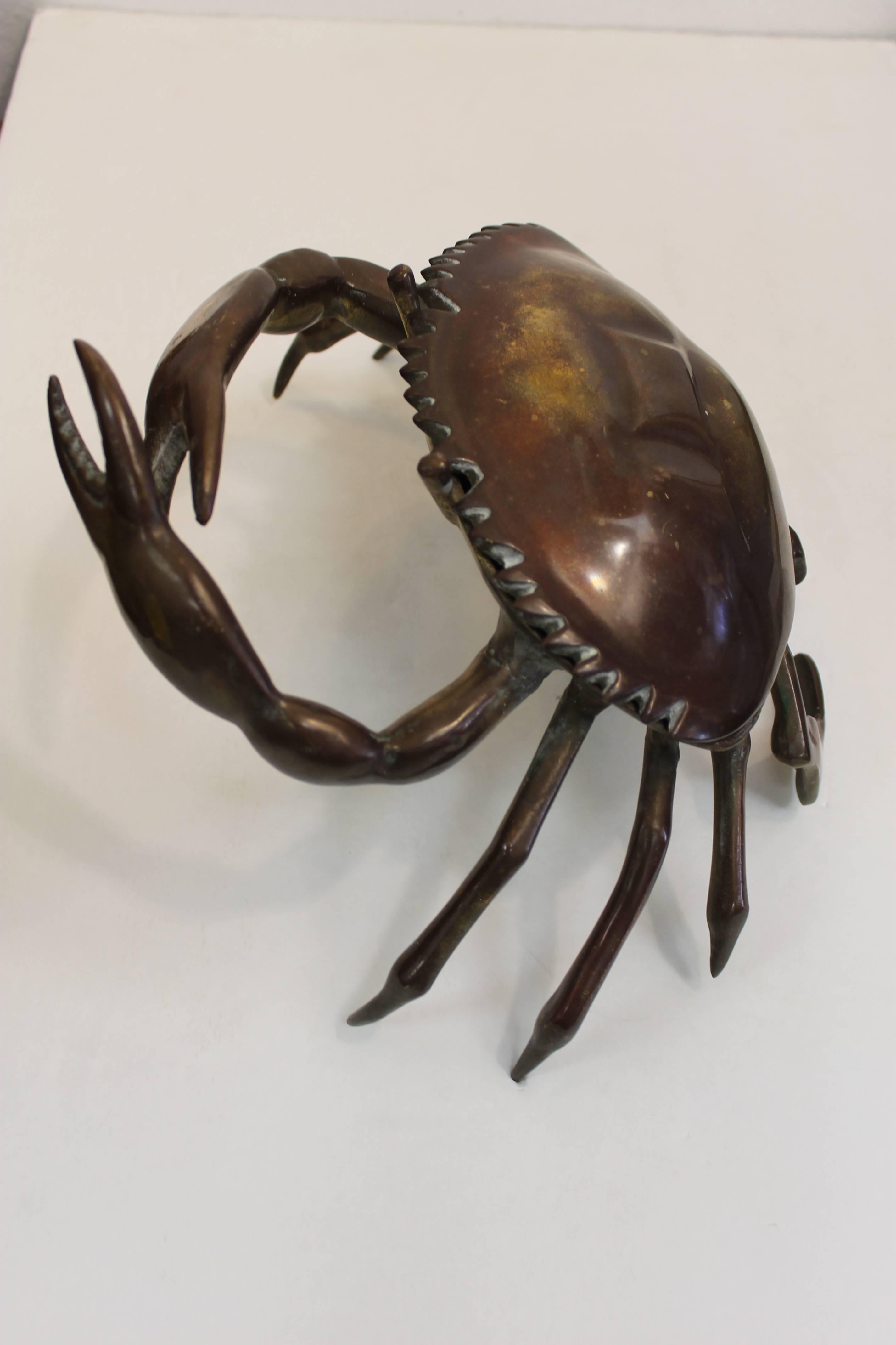 A heavy cast bronze crab figure with hinged shell lid, circa 1950s. Measures 13