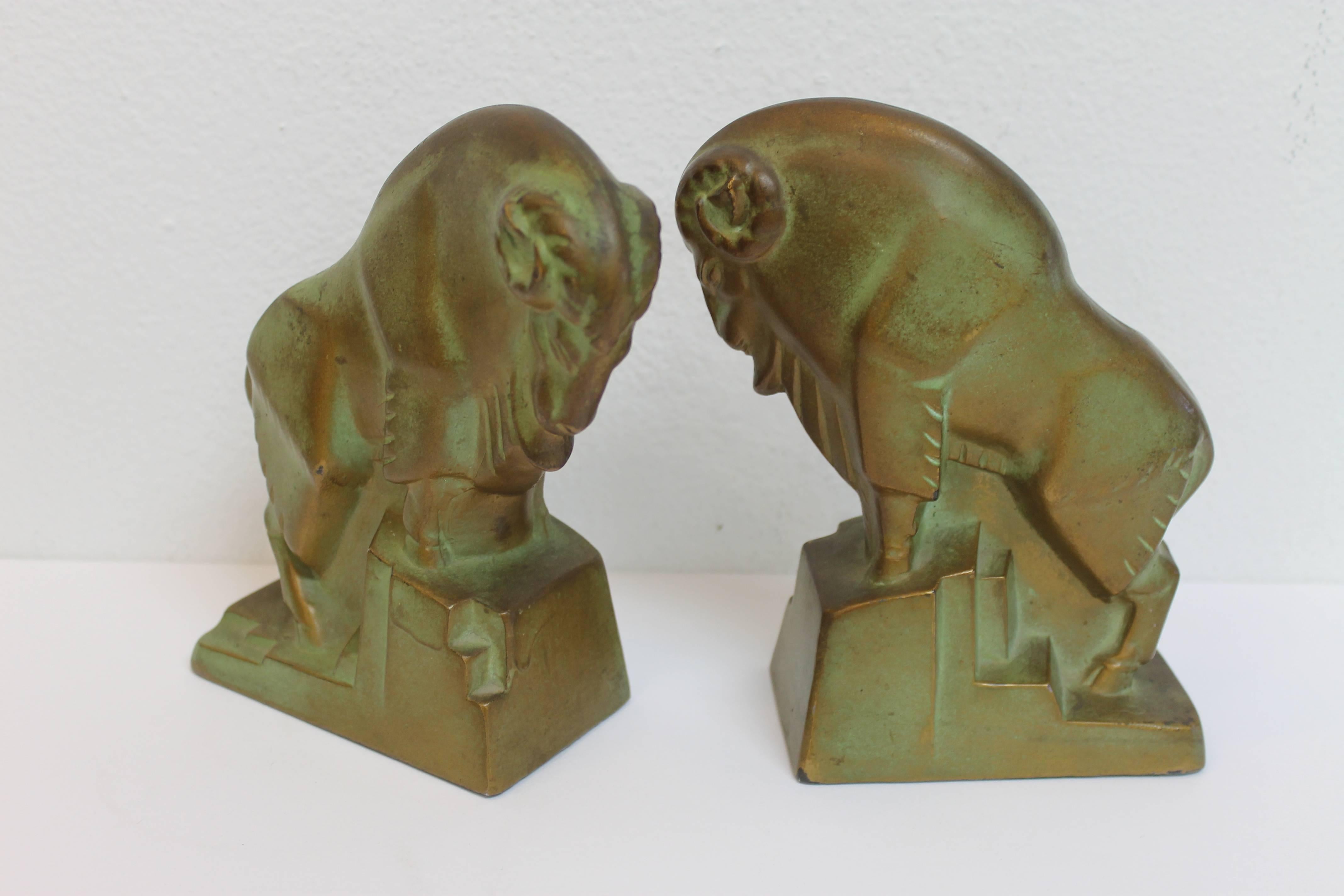 Pair of signed Ram bookends by McClelland Barclay, circa 1930's. These have an incredible bronze, green patina. They measure 6” wide, 3” deep and 7” high.