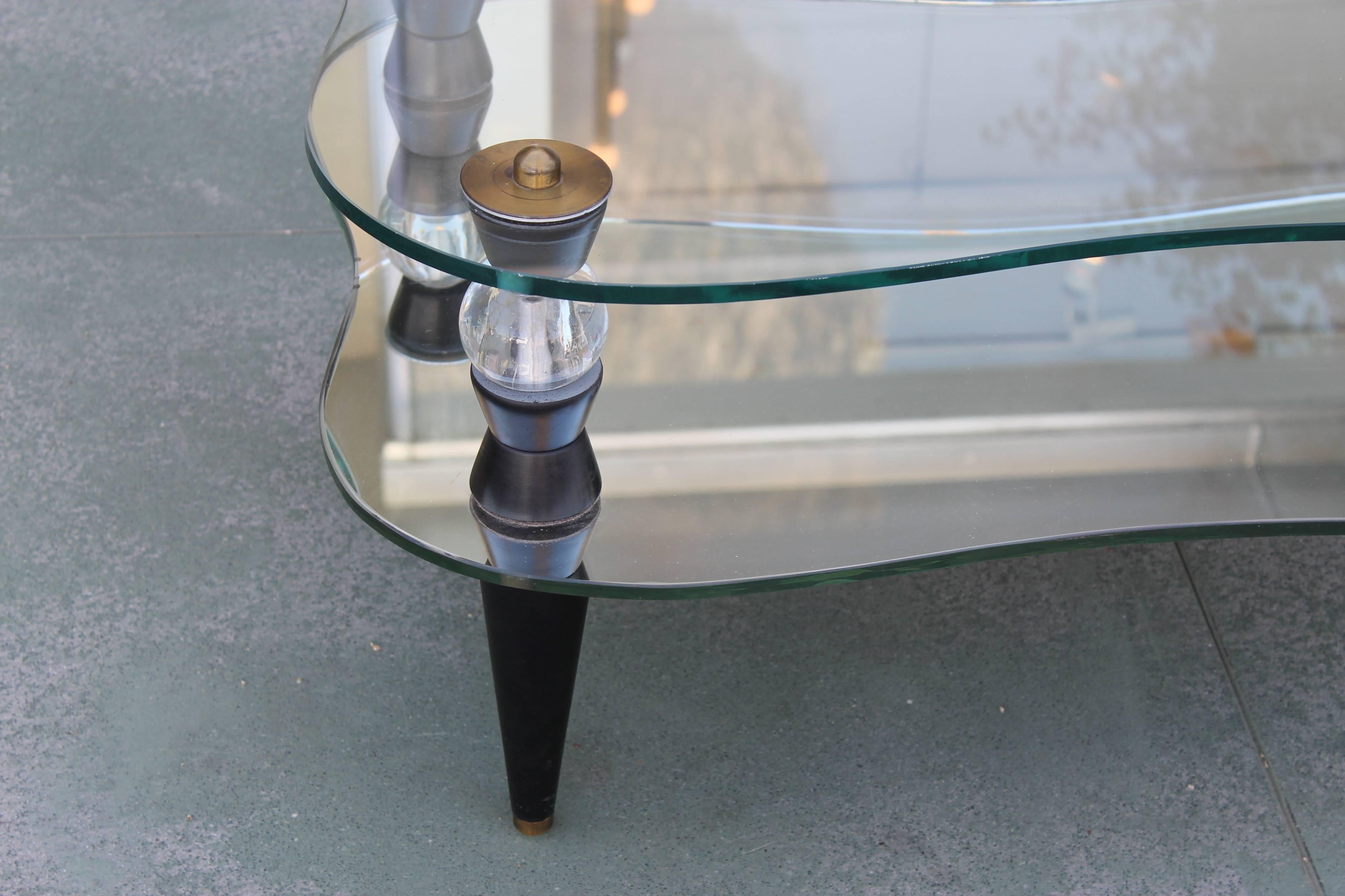 A rare circa early 1950s free-form glass and mirror coffee or occasional table by Morris Modern of California. This table is 36