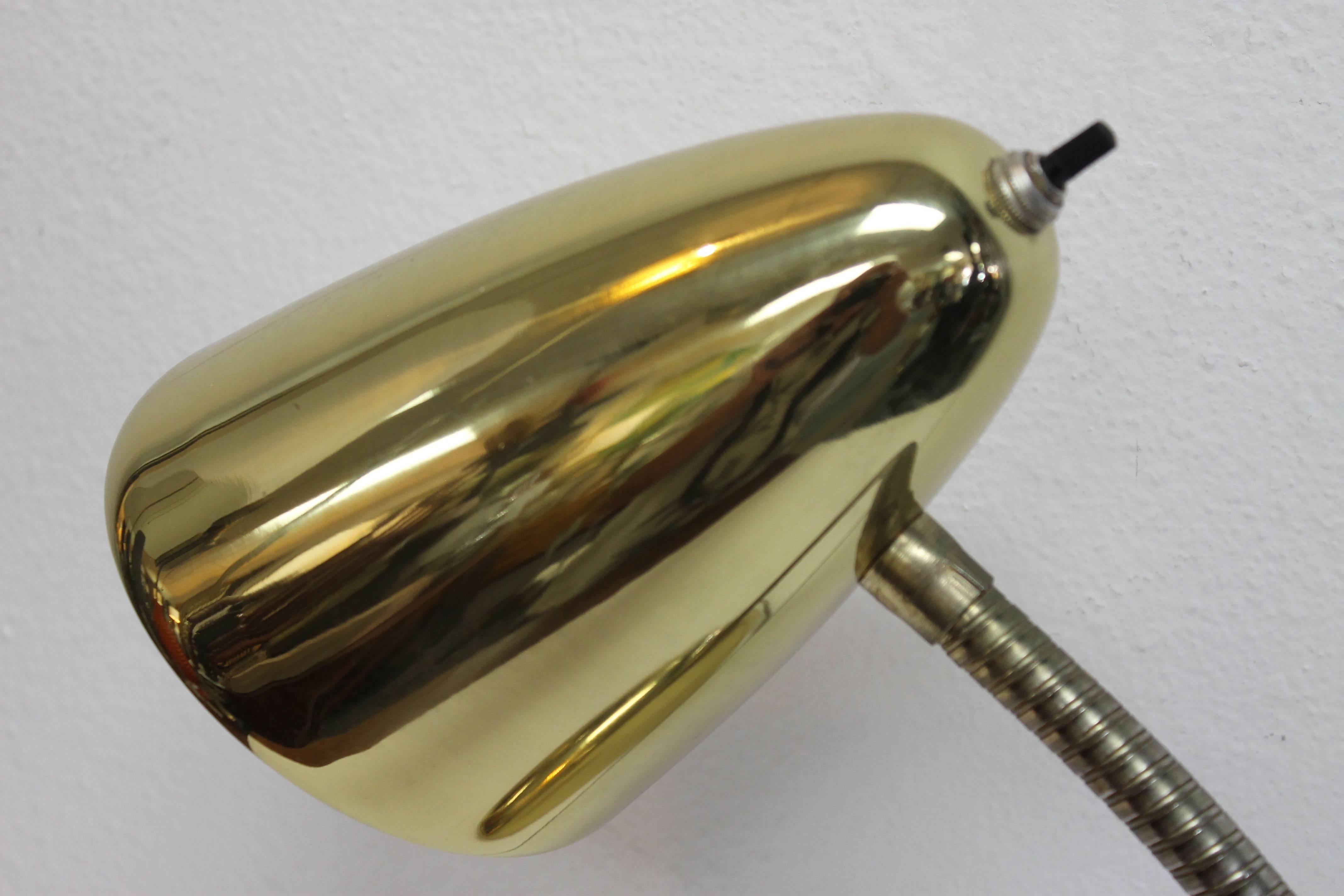 Brass-plated steel goose neck table lamp. Measures (as shown) 18