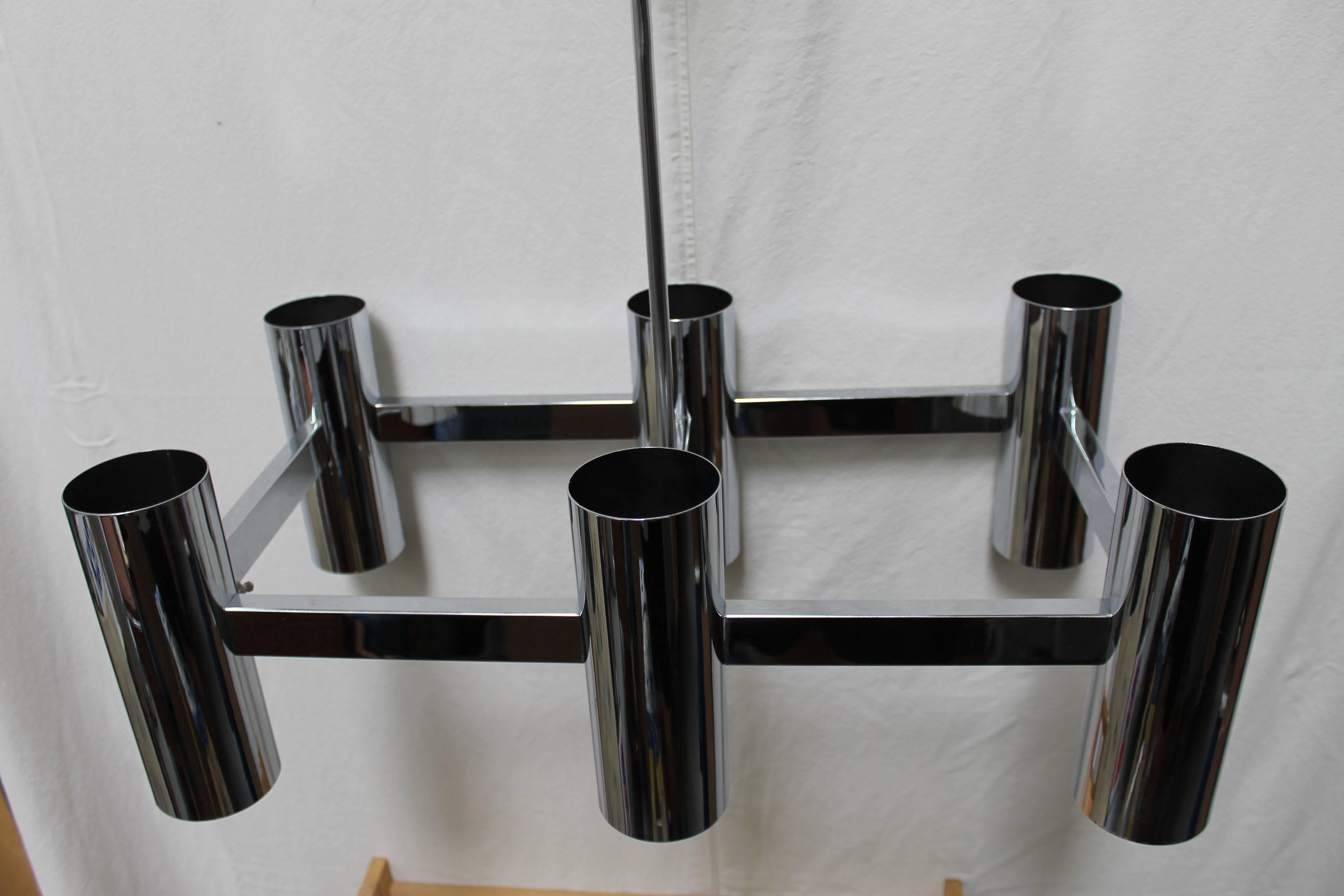 Chrome-plated steel chandelier consisting of six canisters. Three way switch enables you to light the bottom, light the top or both top and bottom. Reminiscent of Laurel or Robert Sonneman Lighting fixtures. Fixture has been professionally rewired.