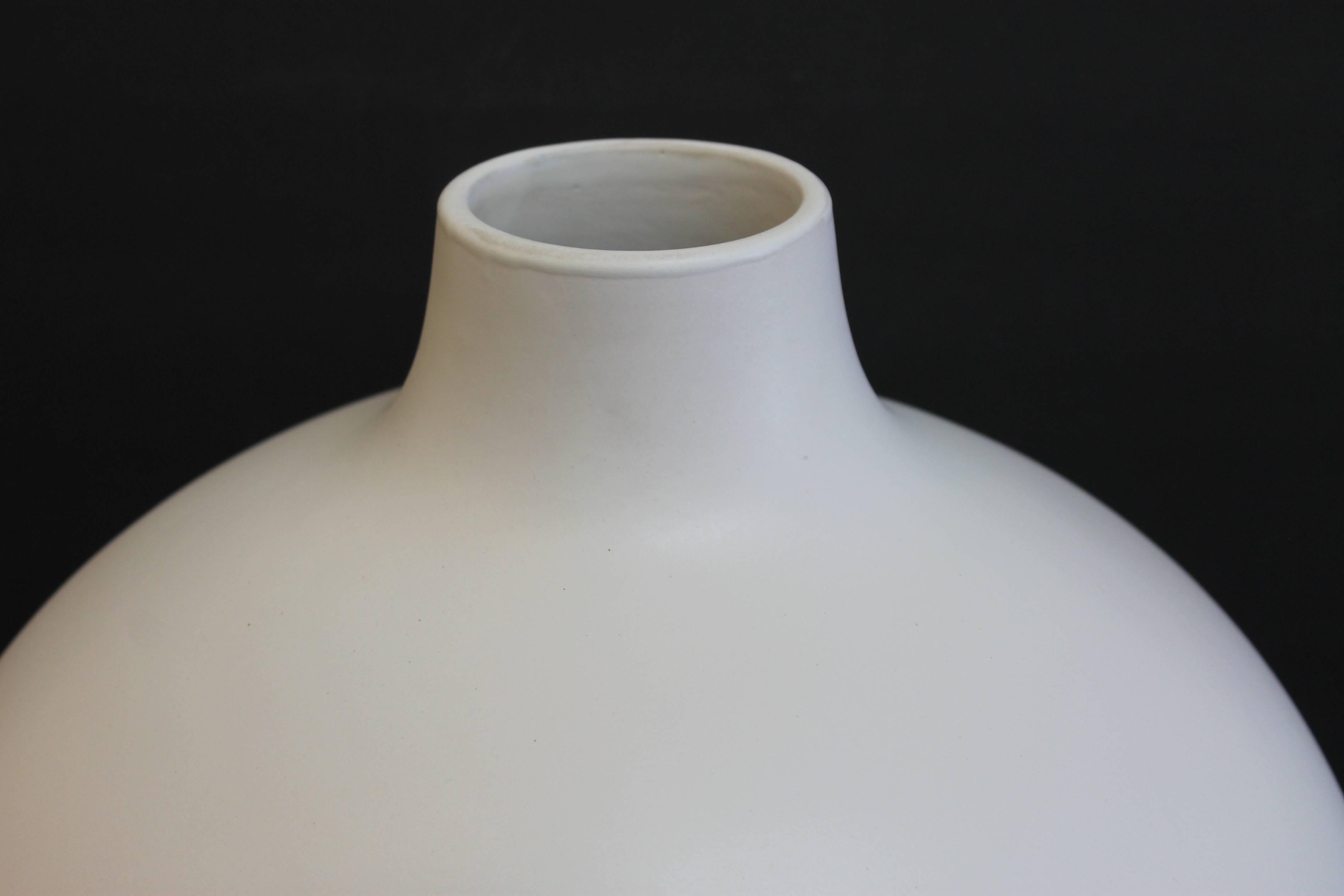 A huge ceramic vase by Mario Bellini, circa 1970s. Tan clay body is glazed in matte white. Hand signed M. Bellini, Milano. Vase is 16