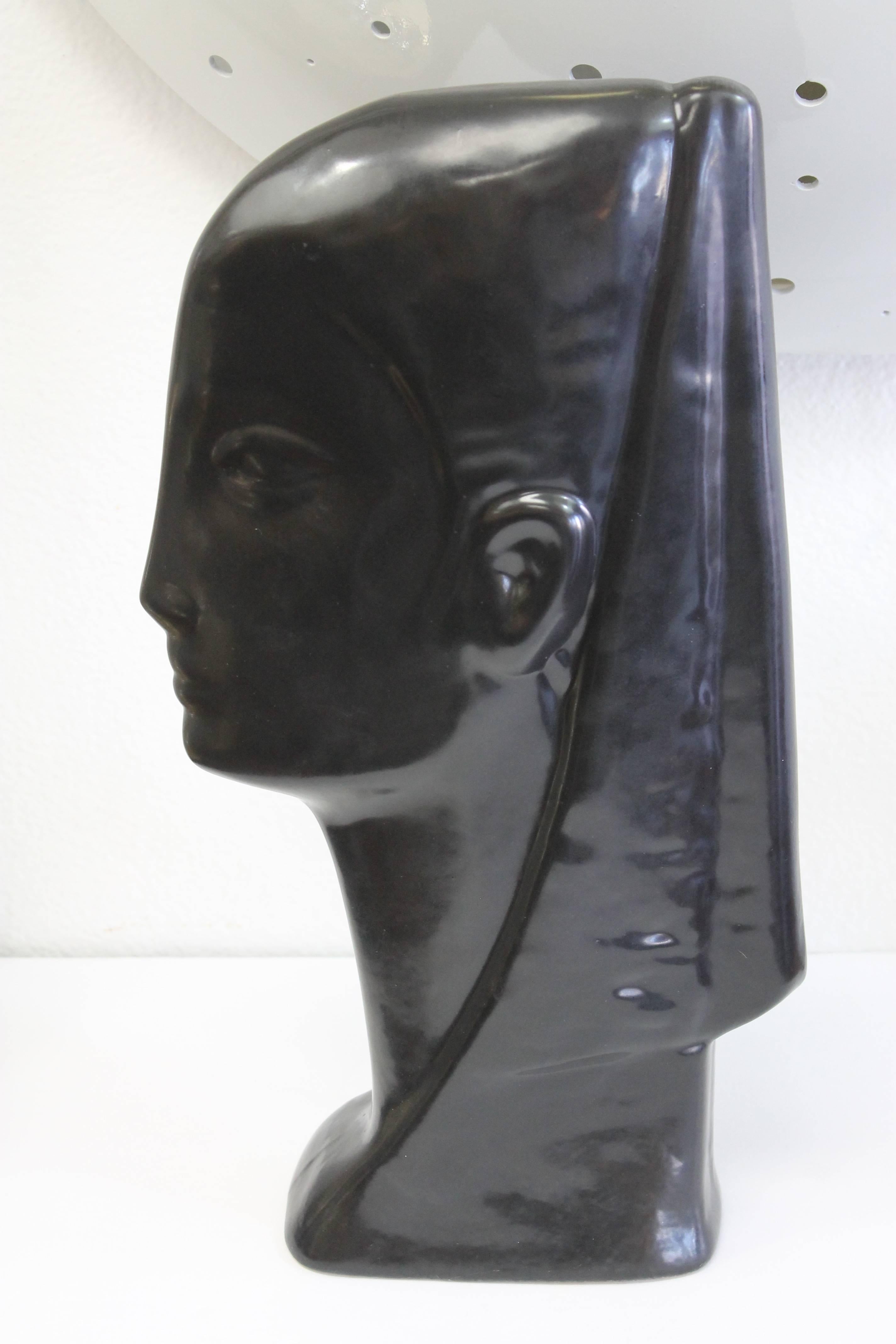 Egyptian inspired ceramic bust, dated 1957 and signed. We cannot make out the signature.