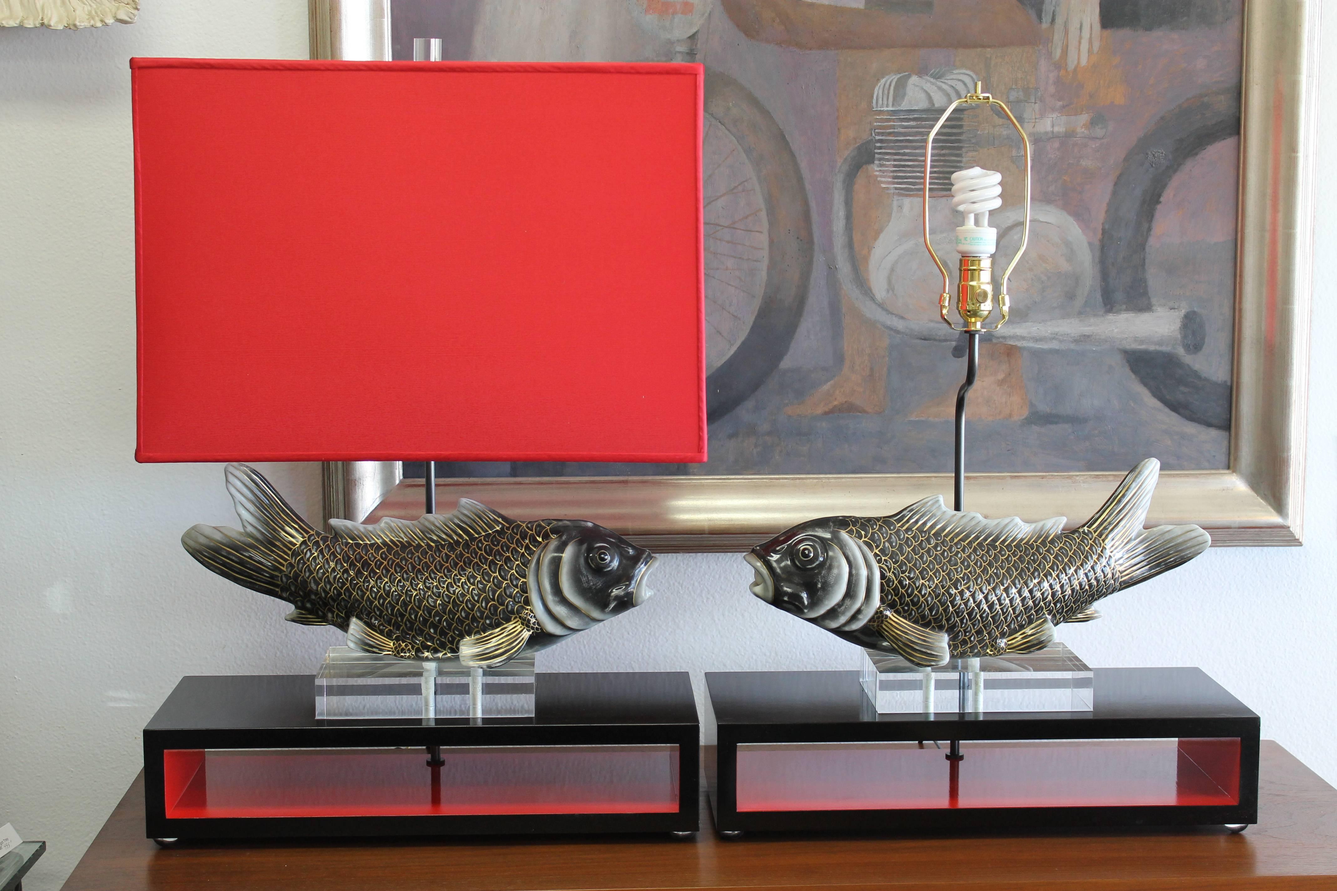 Pair of beautiful custom designed koi lamps with red lamp shades.  The black lacquer base is 20