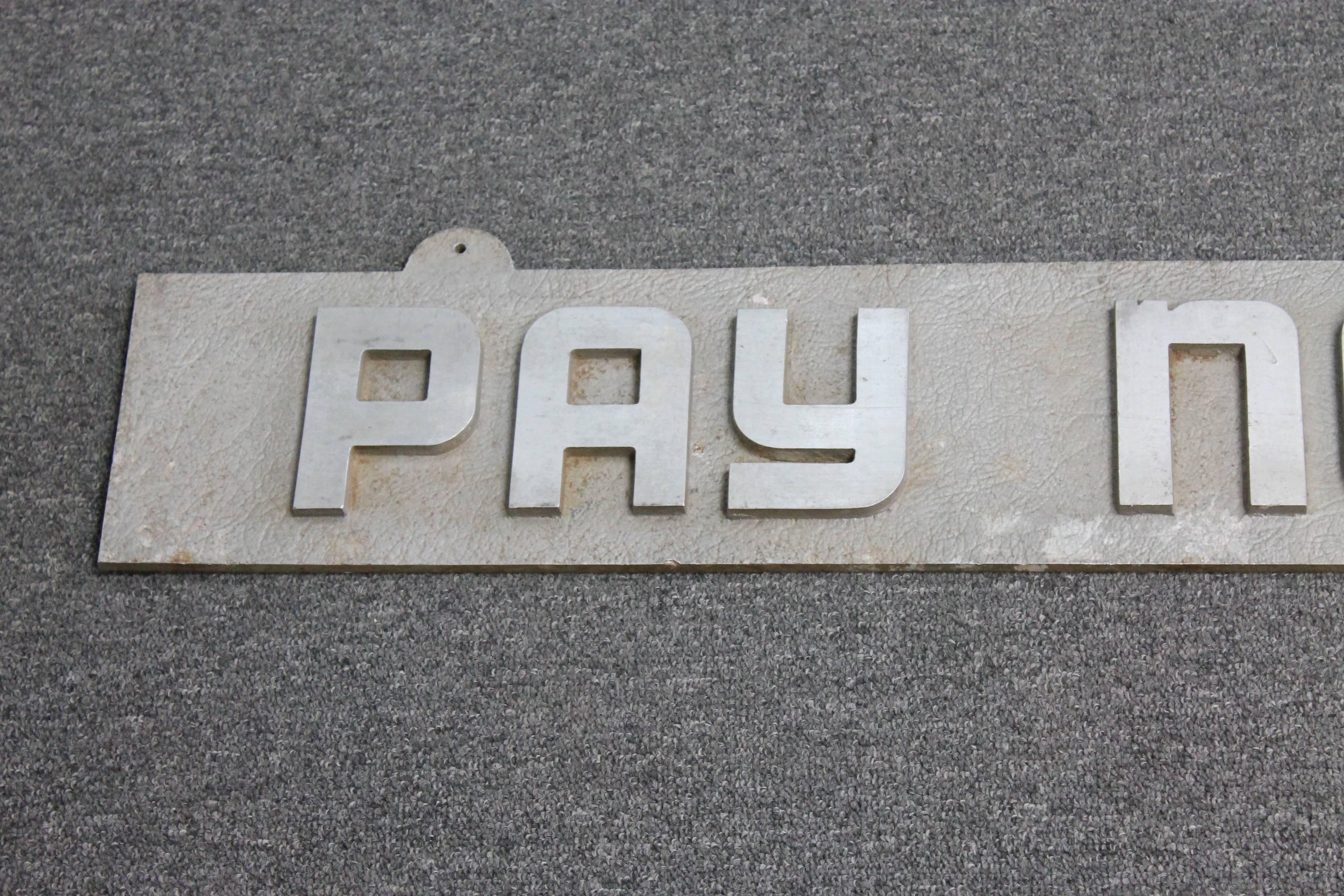Aluminum sign stating 'Pay Notes Here' in raised Art Deco letters. Most likely from a bank during the 1930s. Great architectural Americana.