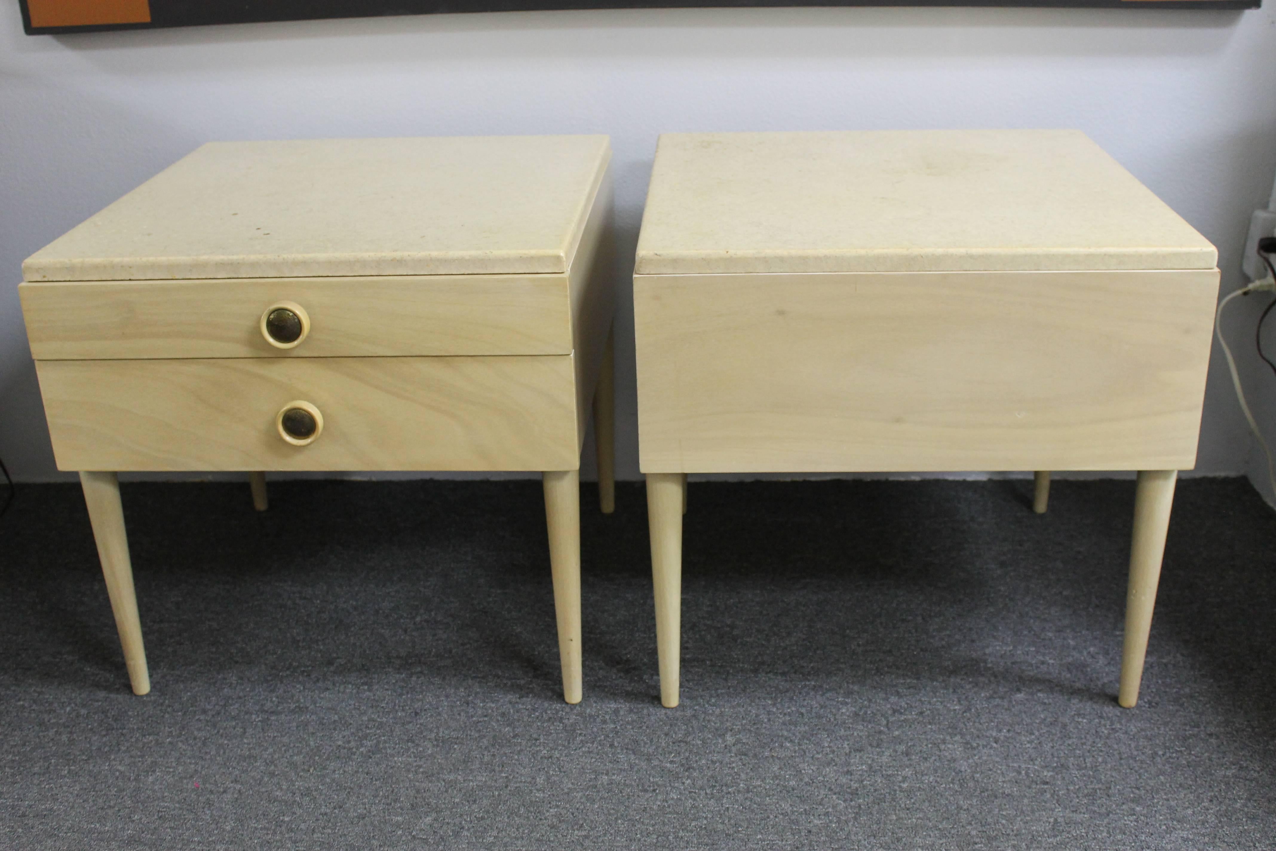 Pair of bedside end tables by Paul Frankl for Johnson Furniture Company, Grand Rapids, Michigan. These are all original including the cork tops. If you'd like we can have the tops redone, meaning lightly sanded and painted to match as close as