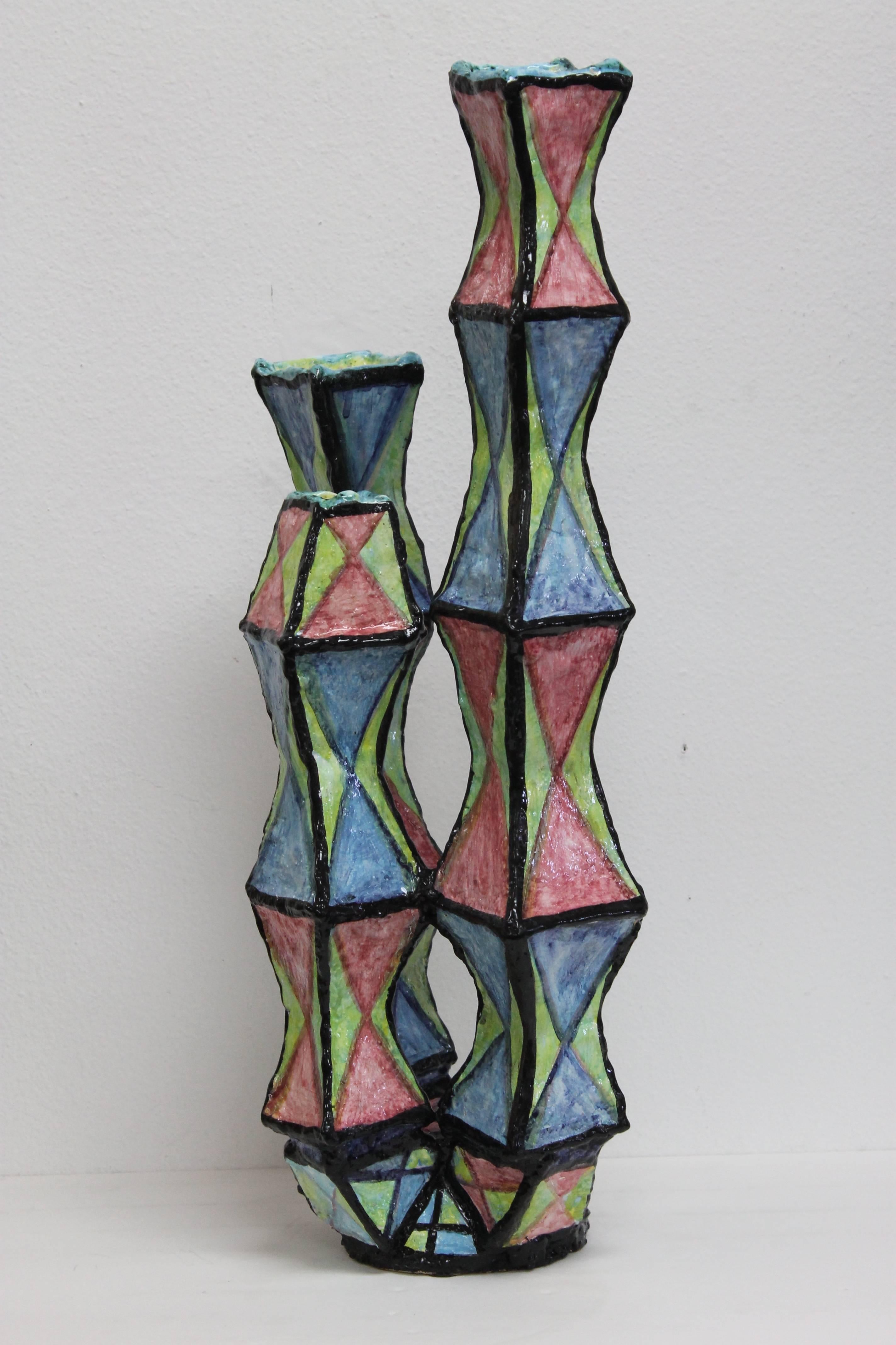 Ceramic sculpture 'Metropolis' sculpture which could be used as a candlestick. Three prongs measure 25”, 19.5” and 16.5” high, 9.5