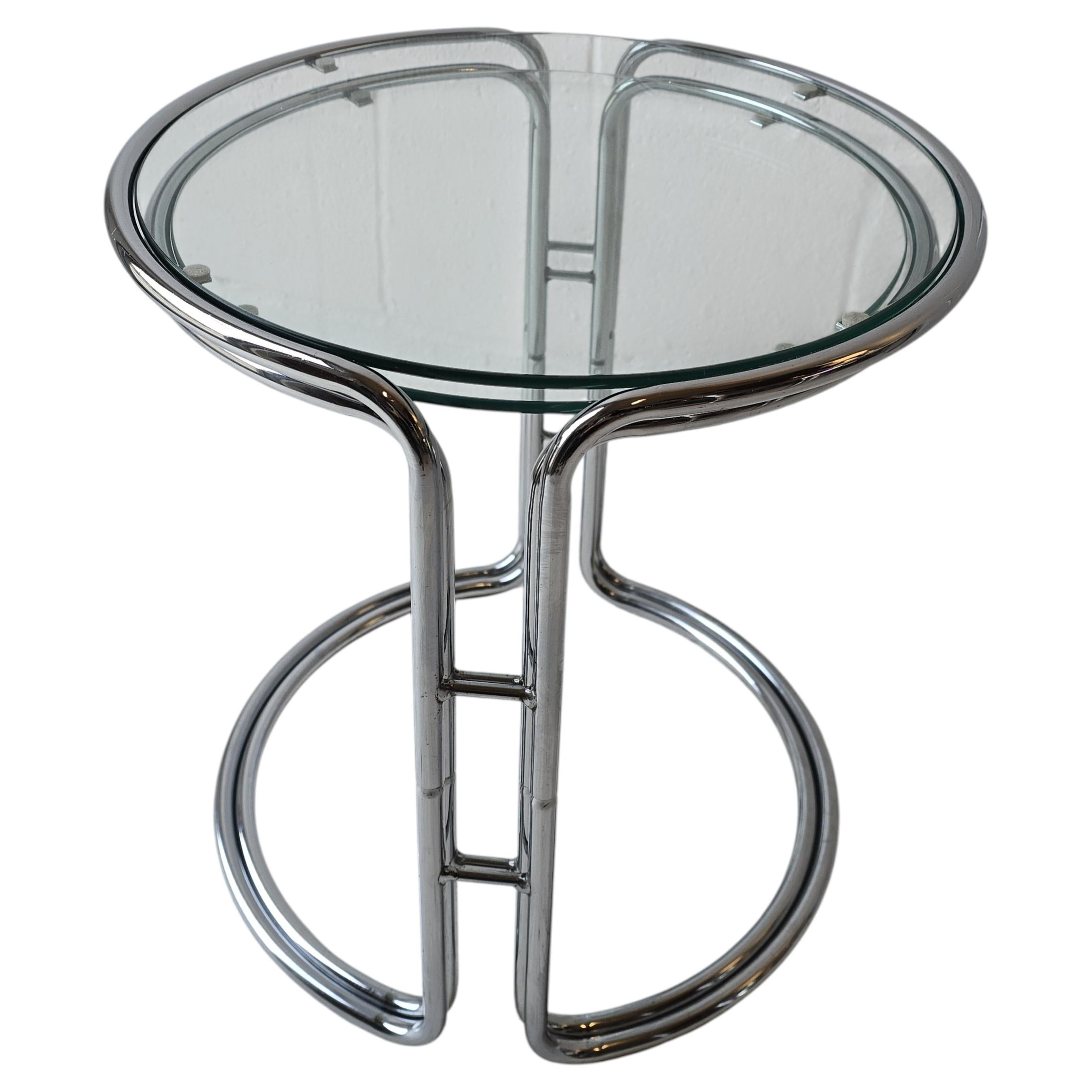 A Pair of Chrome and Glass Nesting Tables For Sale
