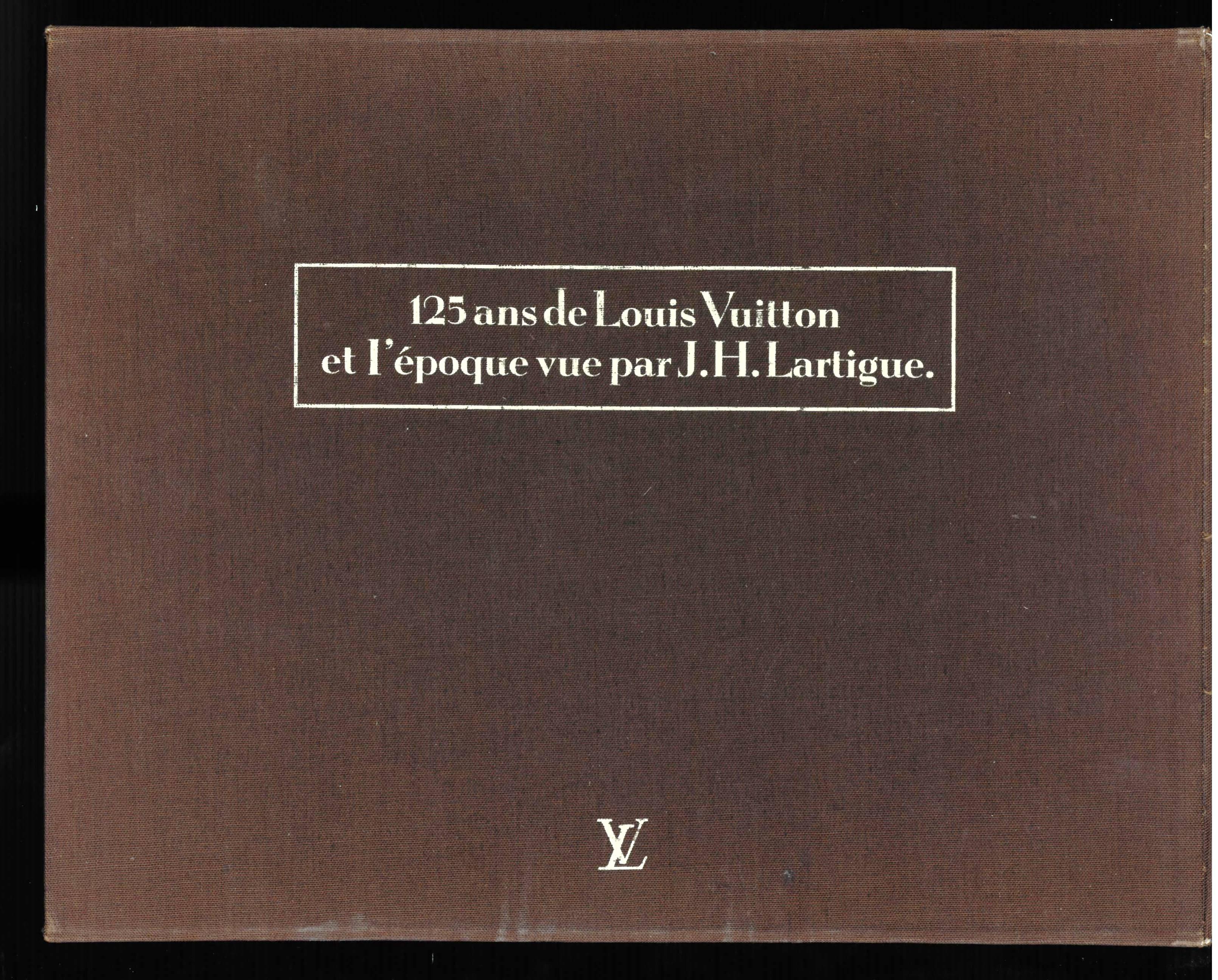 Two books in soft covers housed in a brown cloth covered slip case with cream lettering. One volume illustrates Louis Vuitton products through the years, the second illustrates the 